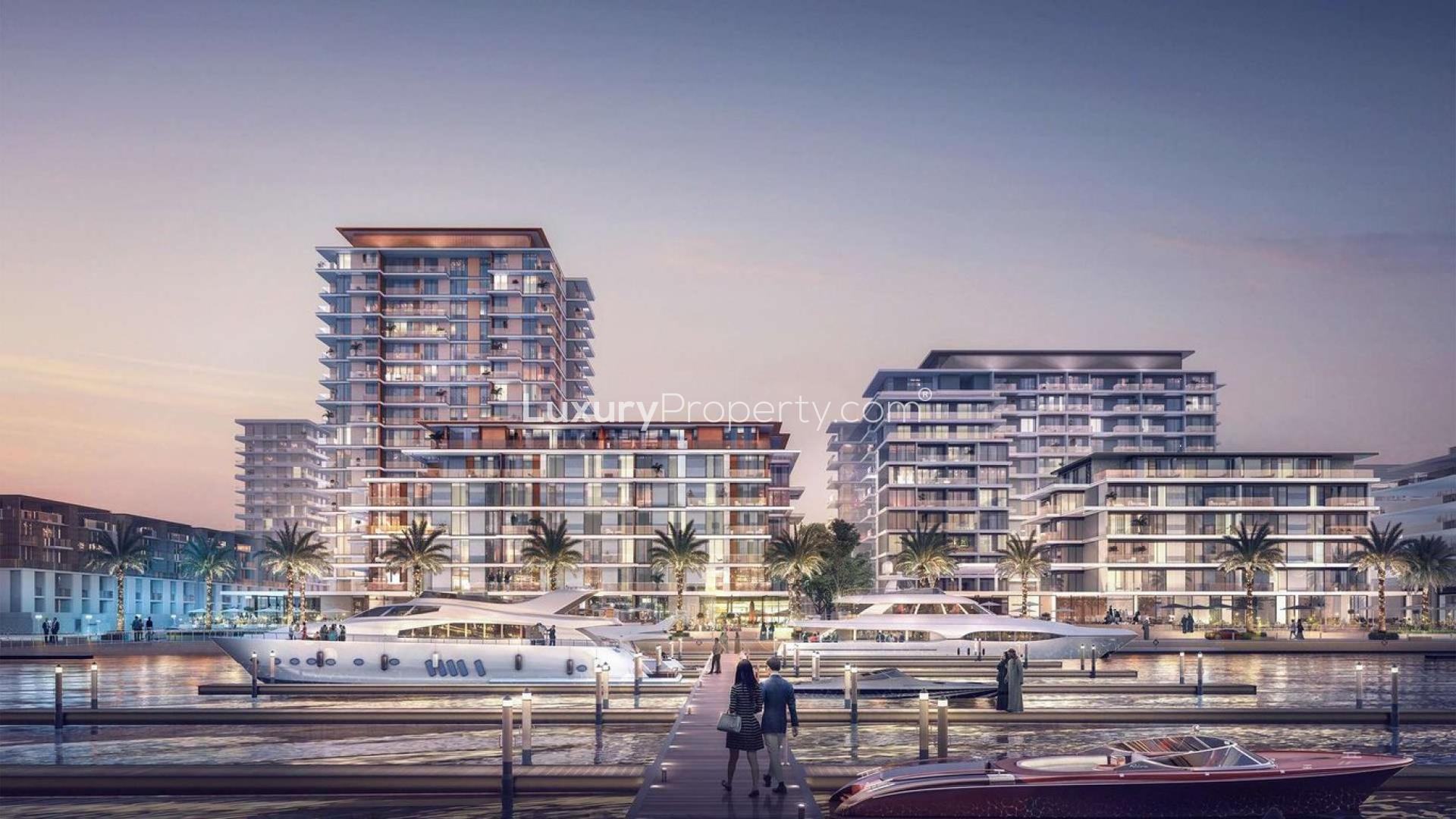 "Elegant living room with marina view in Sirdhana apartment, Mina Rashid by Emaar.","Luxurious waterfront apartments at Sirdhana, Mina Rashid with stunning marina views by Emaar.",Modern kitchen and dining area in Sirdhana apartment, Mina Rashid by Emaar