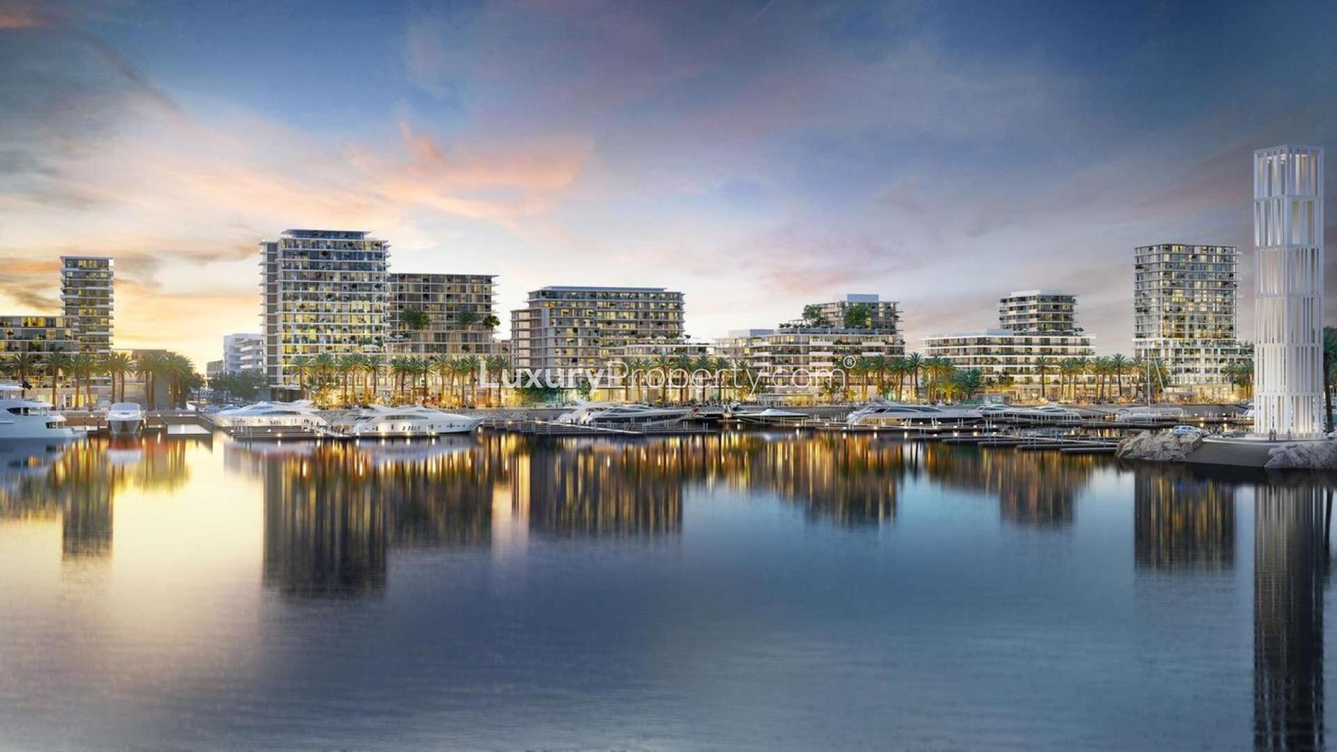 "Modern apartment building near Dubai Mall by the sea in Sirdhana, Mina Rashid.",Waterfront view of Sirdhana apartments at Mina Rashid with marina and sunset reflections