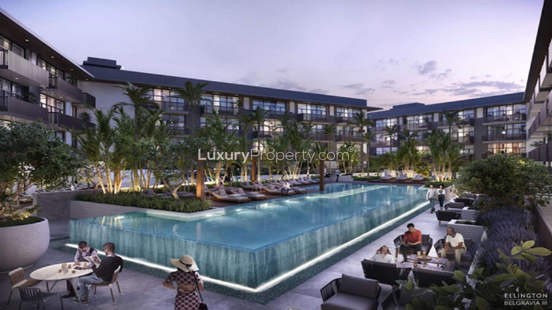 Courtyard view of Belgravia III, Jumeirah Village Circle, featuring pool and landscaped gardens