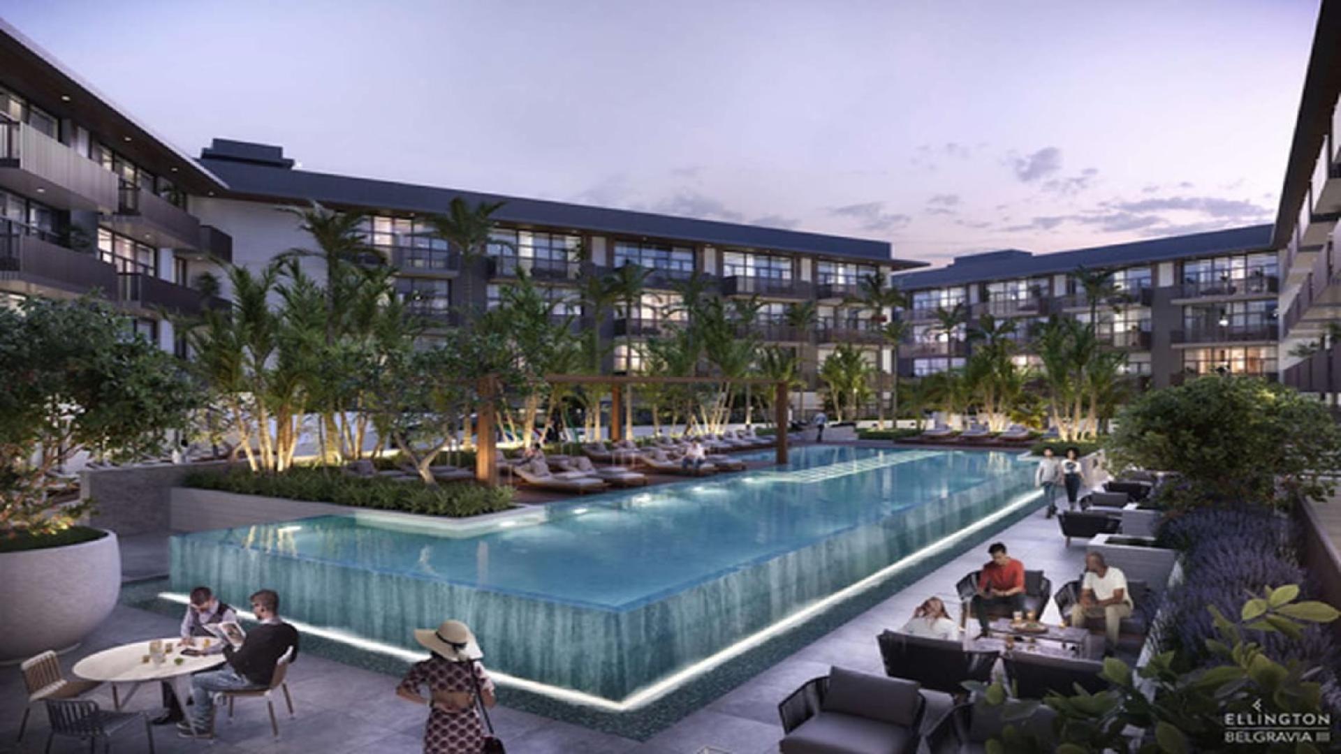 Courtyard view of Belgravia III, Jumeirah Village Circle, featuring pool and landscaped gardens
