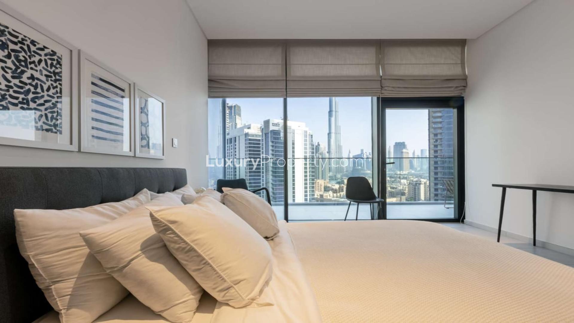 Studio apartment interior at Marquise Square, Business Bay, featuring modern decor and large windows