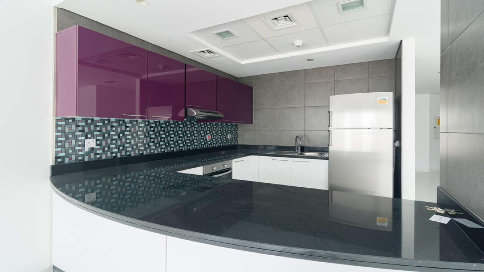 Luxurious studio kitchen and living area in Cayan Tower, Dubai Marina apartment for sale