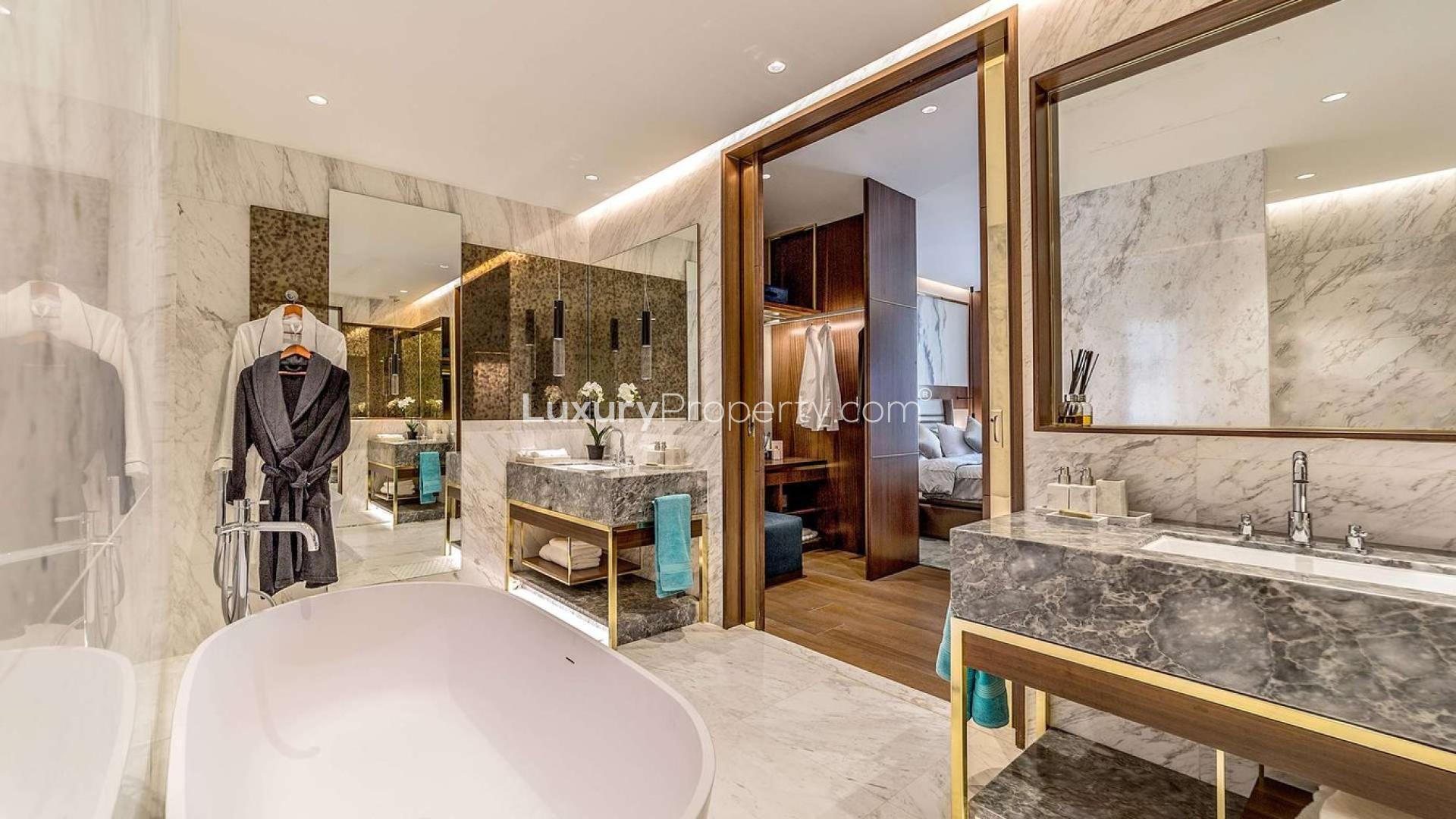 Elegant living room in one-bedroom suite, Langham Place, Downtown Dubai, with modern decor and views