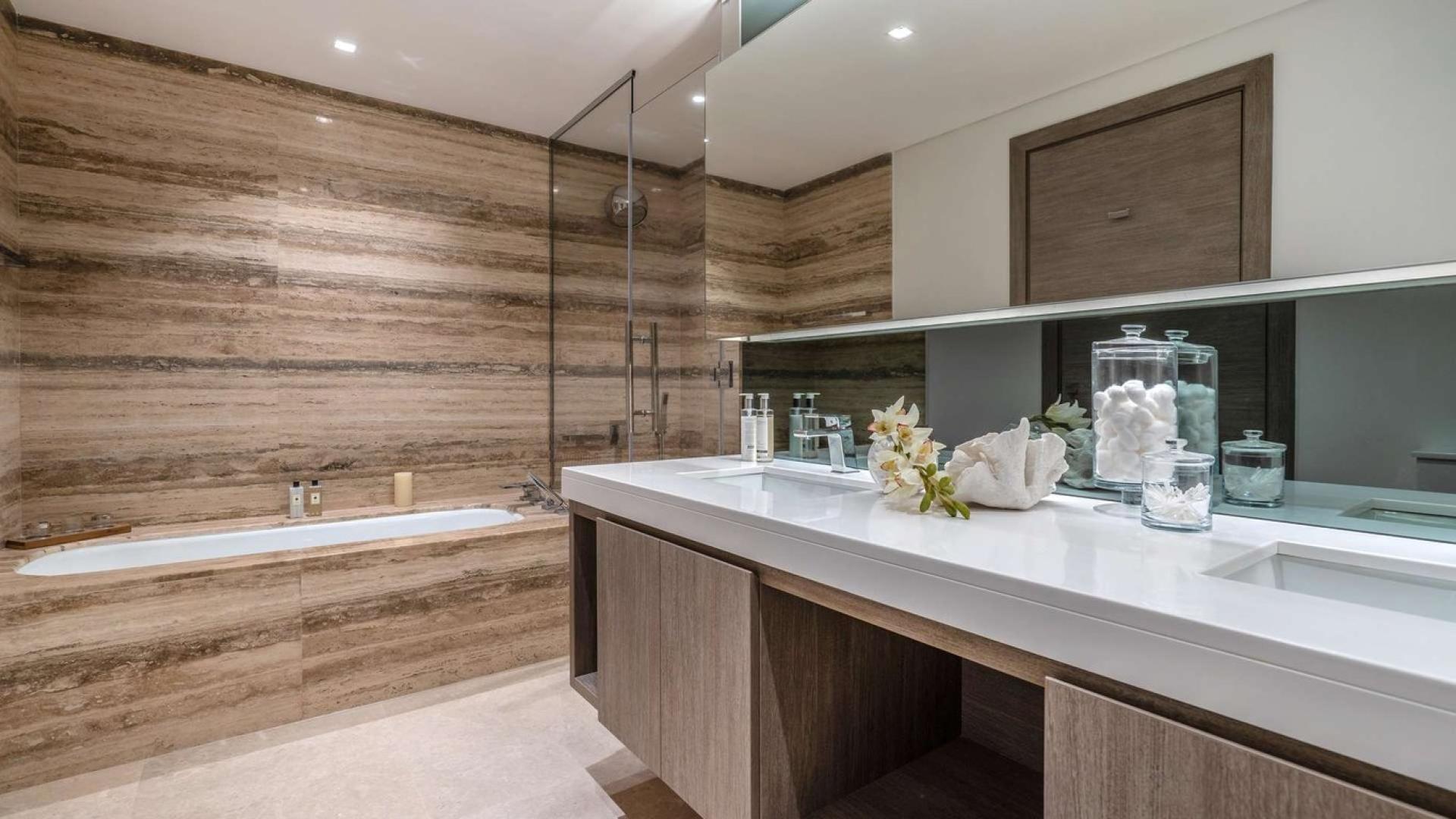 Modern living and dining area in three-bedroom apartment at The Sterling, Business Bay