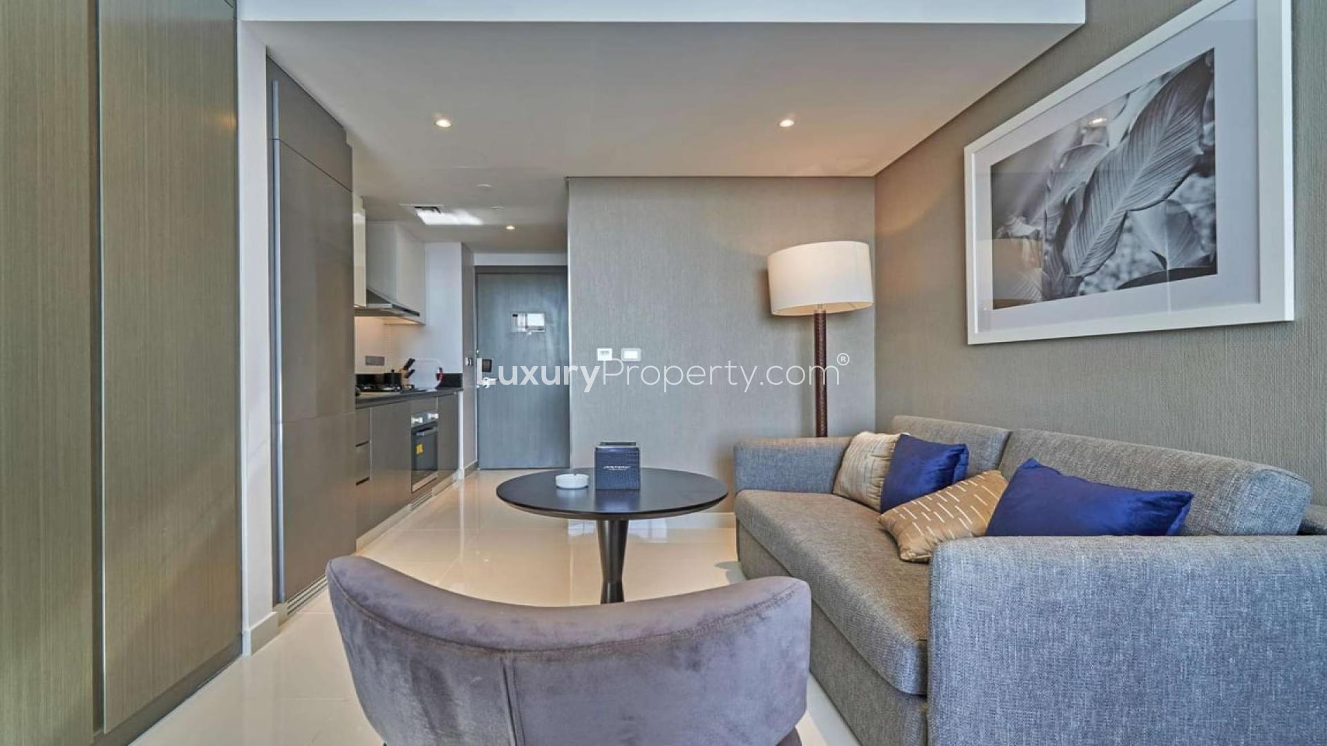 Furnished studio apartment interior in Damac Maison Prive, Business Bay, featuring cozy bedroom