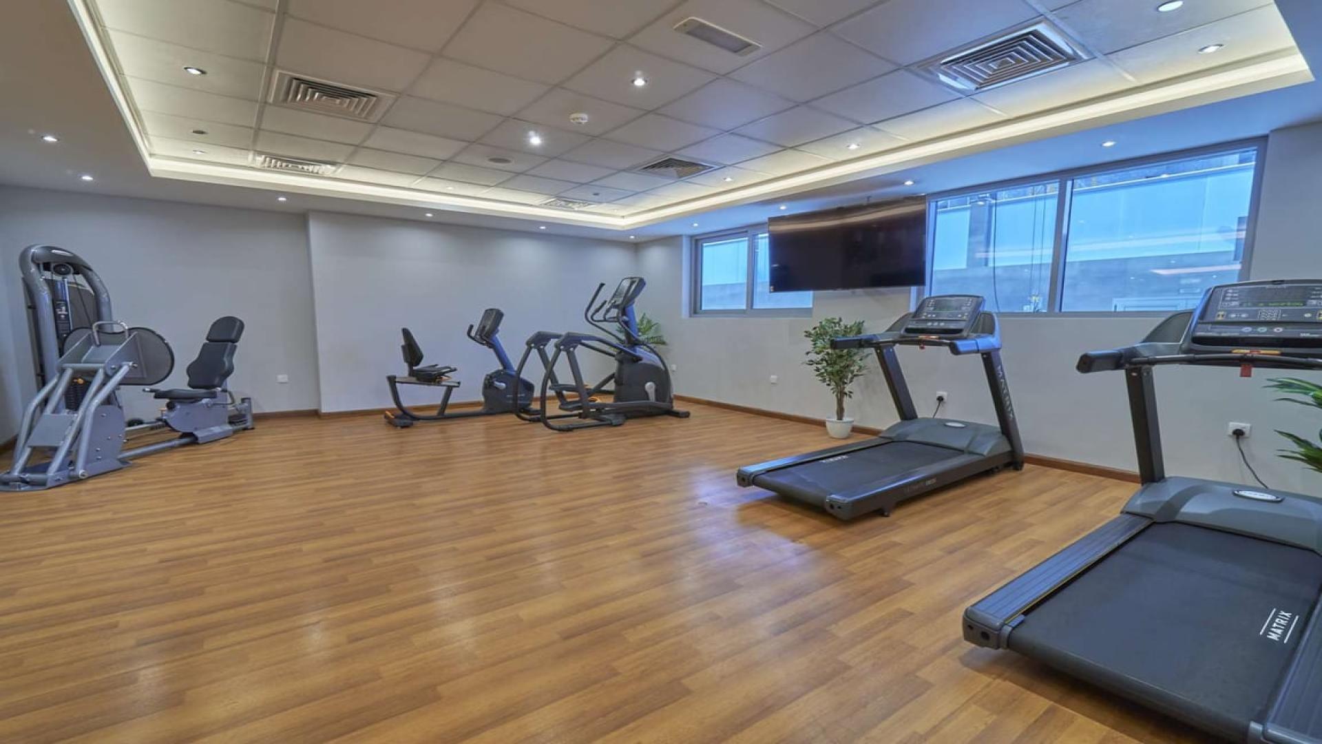 Studio apartment interior at Elite Business Bay Residence, featuring modern living and dining area