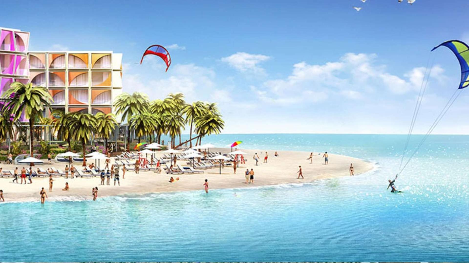 Luxurious beachfront studio apartment with vibrant architecture, pool, and ocean view at The World Islands