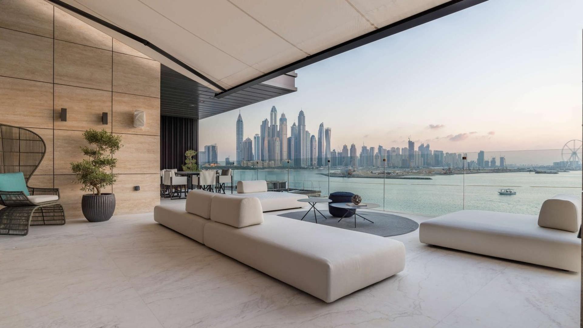 Luxurious living room with ocean view in 5-bedroom duplex, Palm Jumeirah apartment for sale