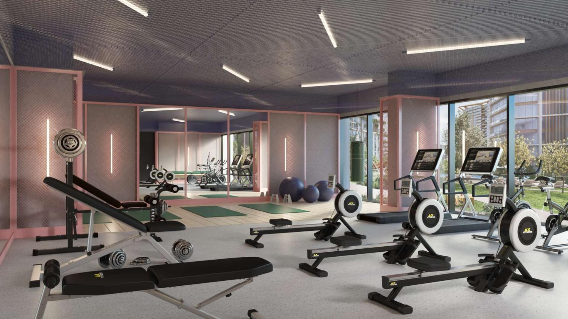 "Modern Viridian apartment exterior at City Walk, Central Park by Meraas, available for sale.",Modern gym in Viridian apartment, City Walk, with exercise equipment and outdoor views