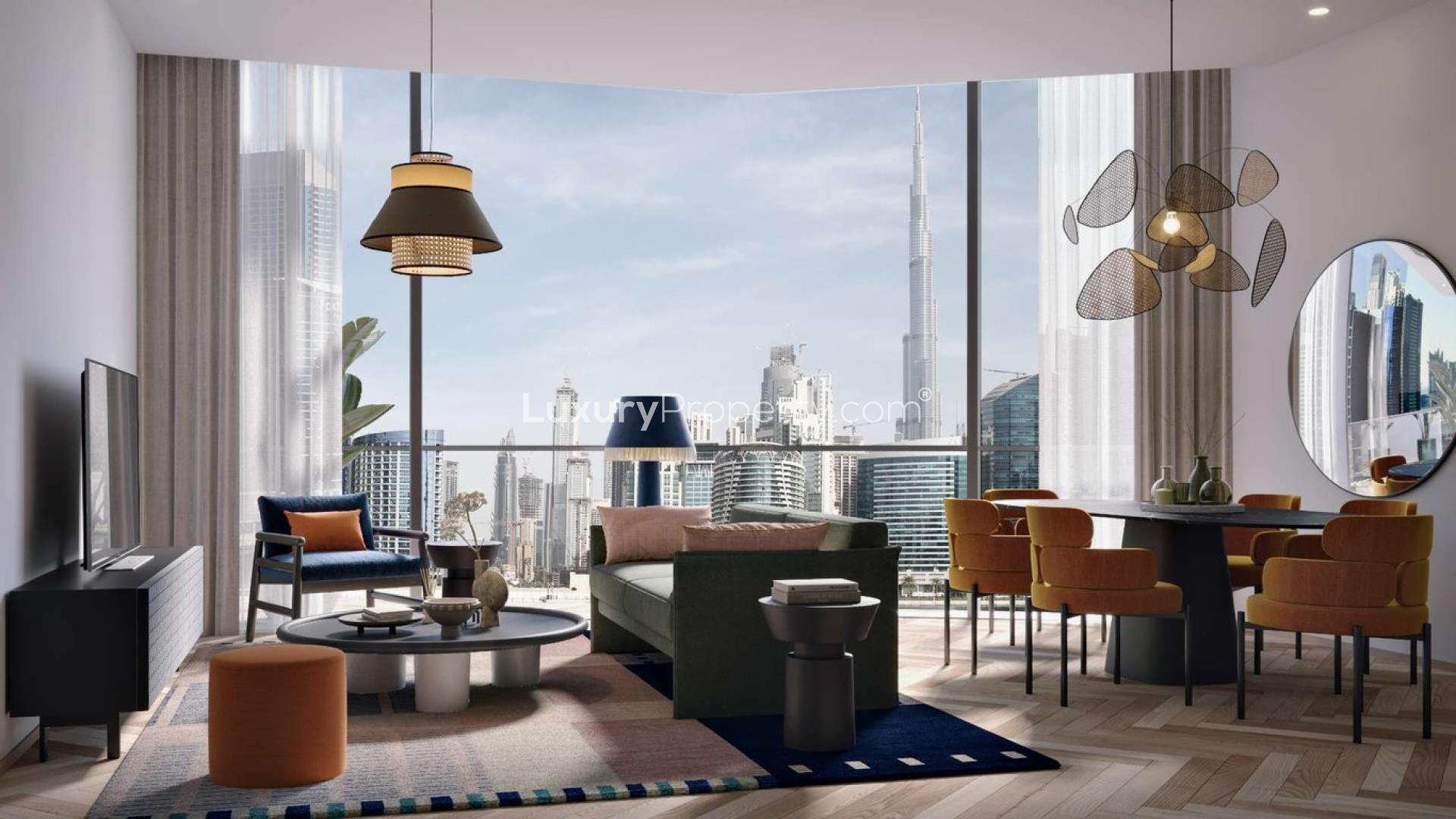 "Modern hallway in Peninsula Three apartment, Business Bay, with elevators and artwork on walls.",Modern studio apartment interior in Peninsula Three, Business Bay, with Burj Khalifa view