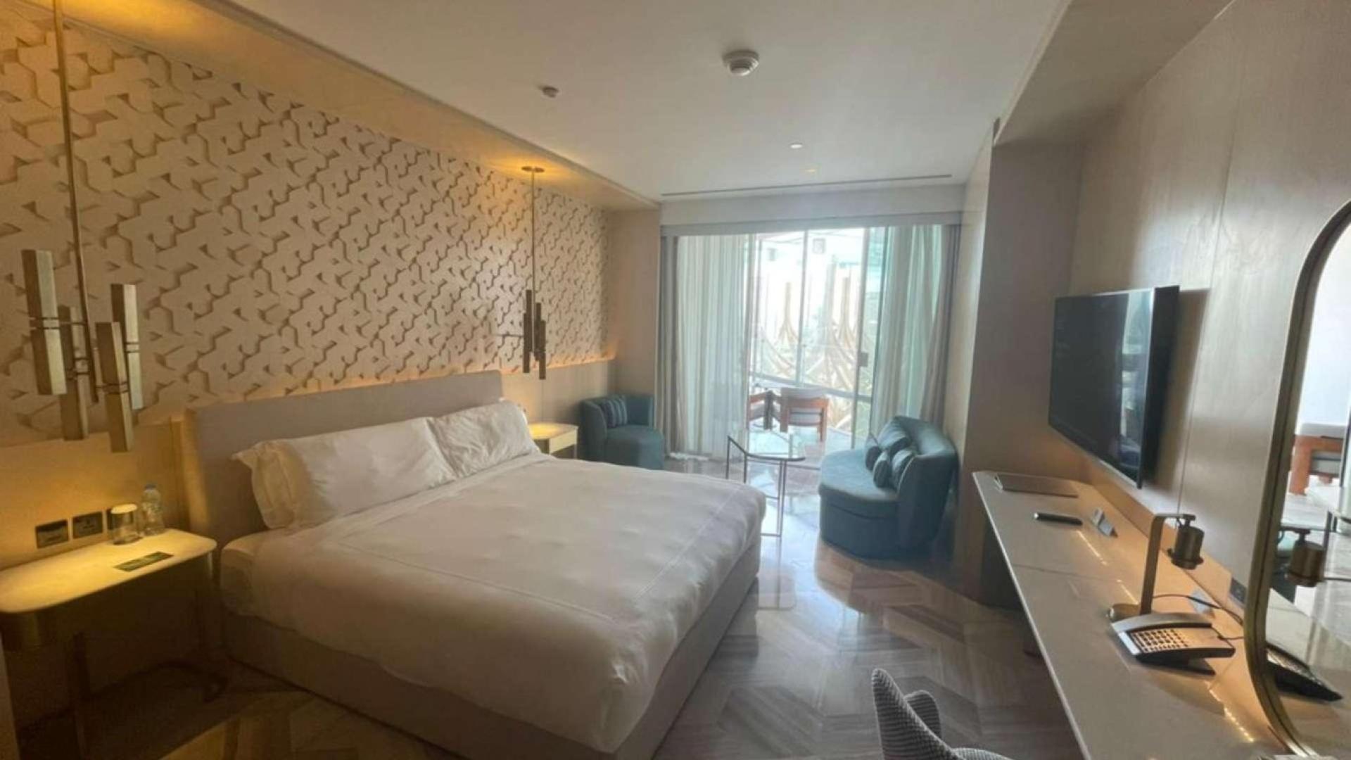 Furnished studio apartment interior at FIVE Palm Jumeirah with modern decor and lighting