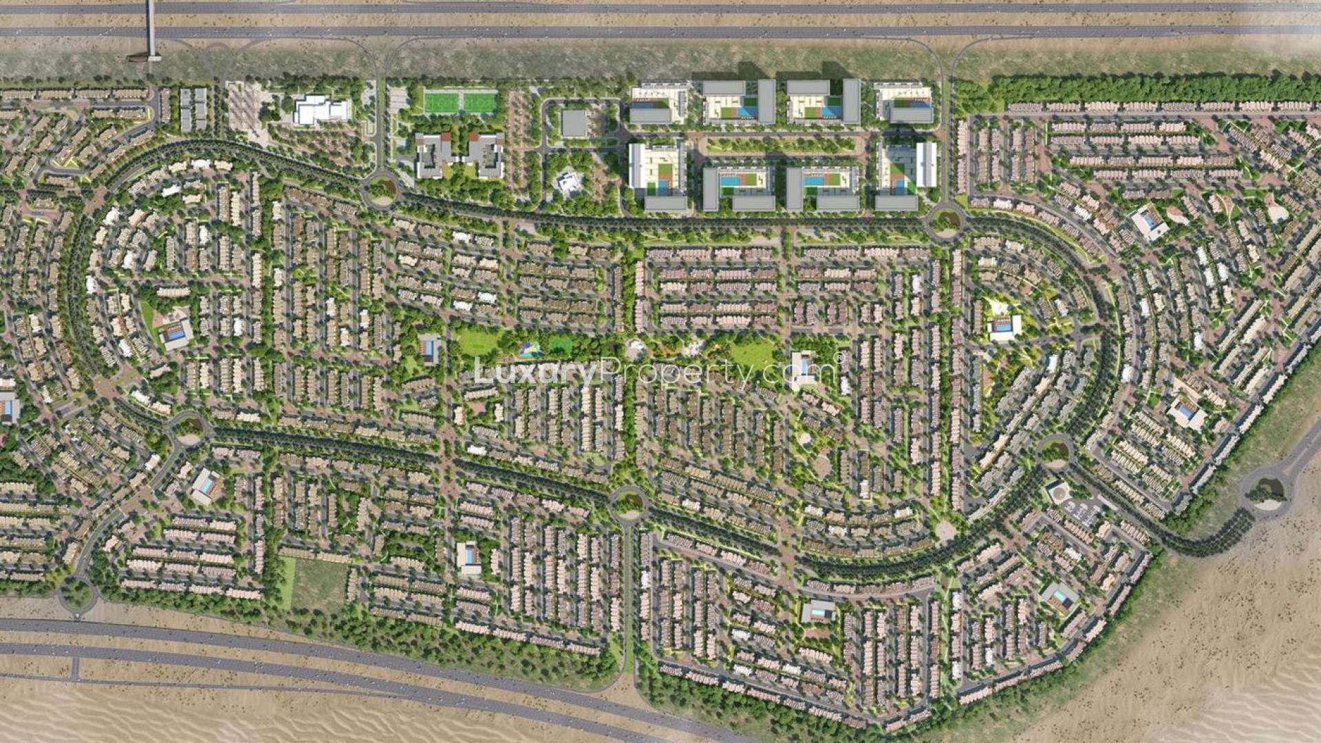 Aerial view of lush green park and lazy river in Arabian Ranches III, Dubailand