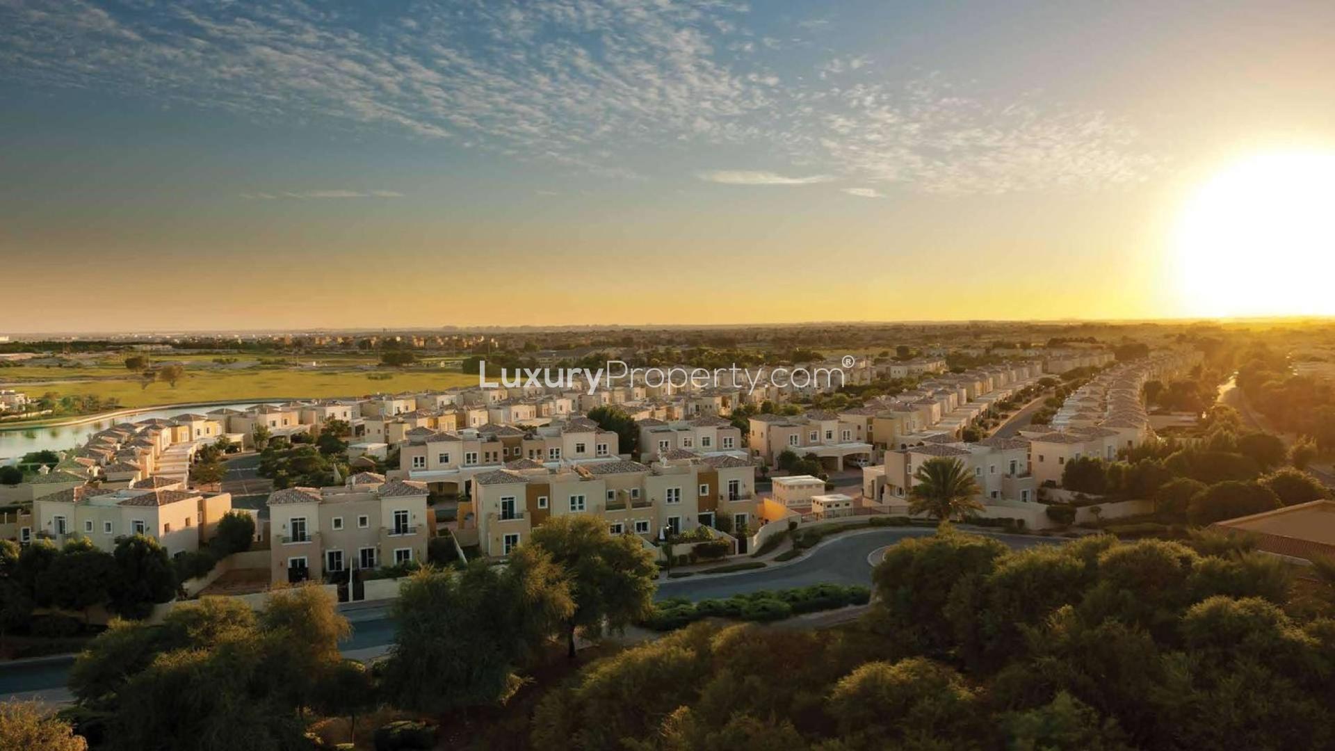 Aerial view of Arabian Ranches III townhouses at sunset, Dubailand real estate for sale