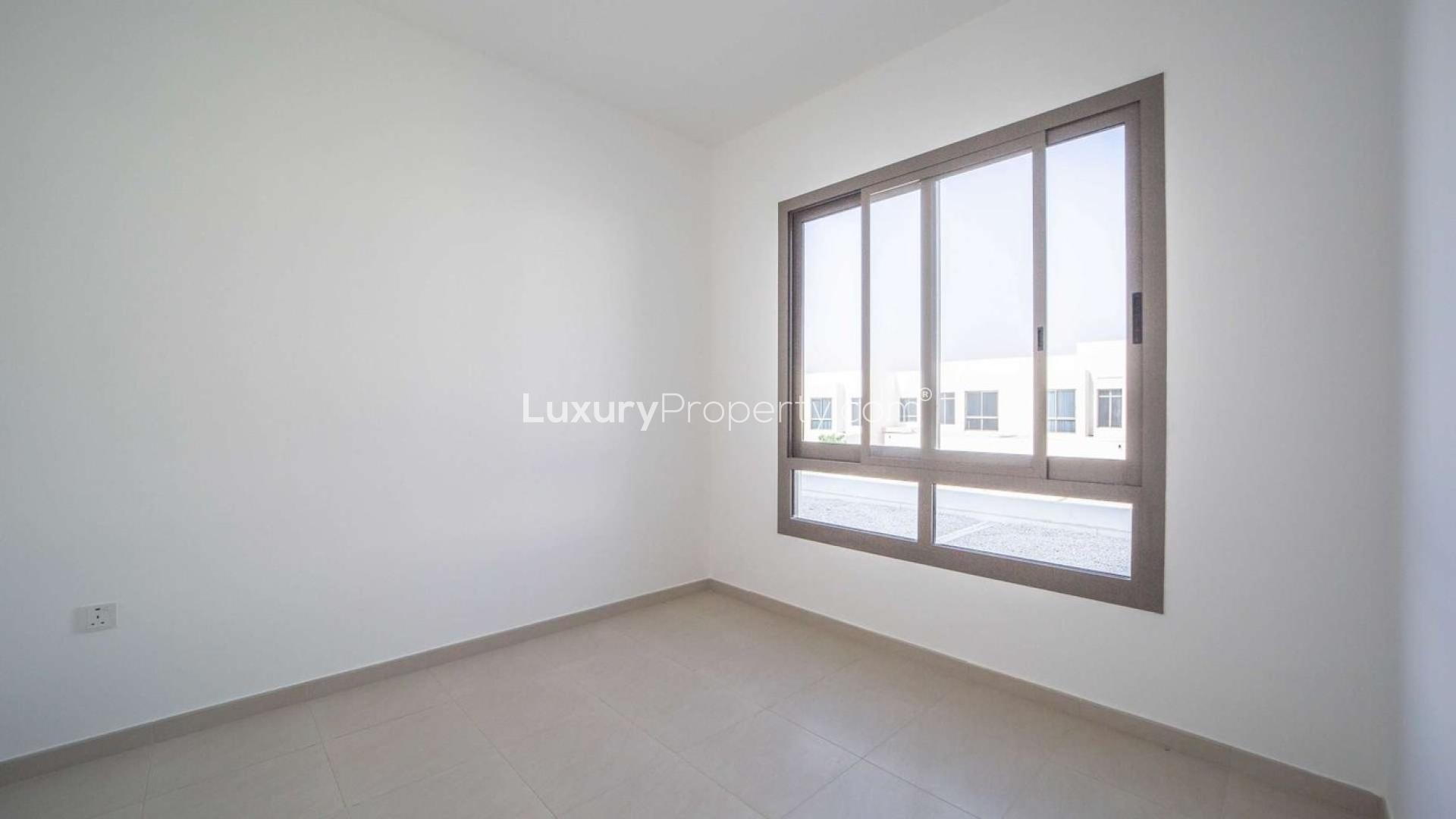 Luxury townhouses at Hayat Townhouses, Dubai Town Square, featuring modern architecture and spacious layout