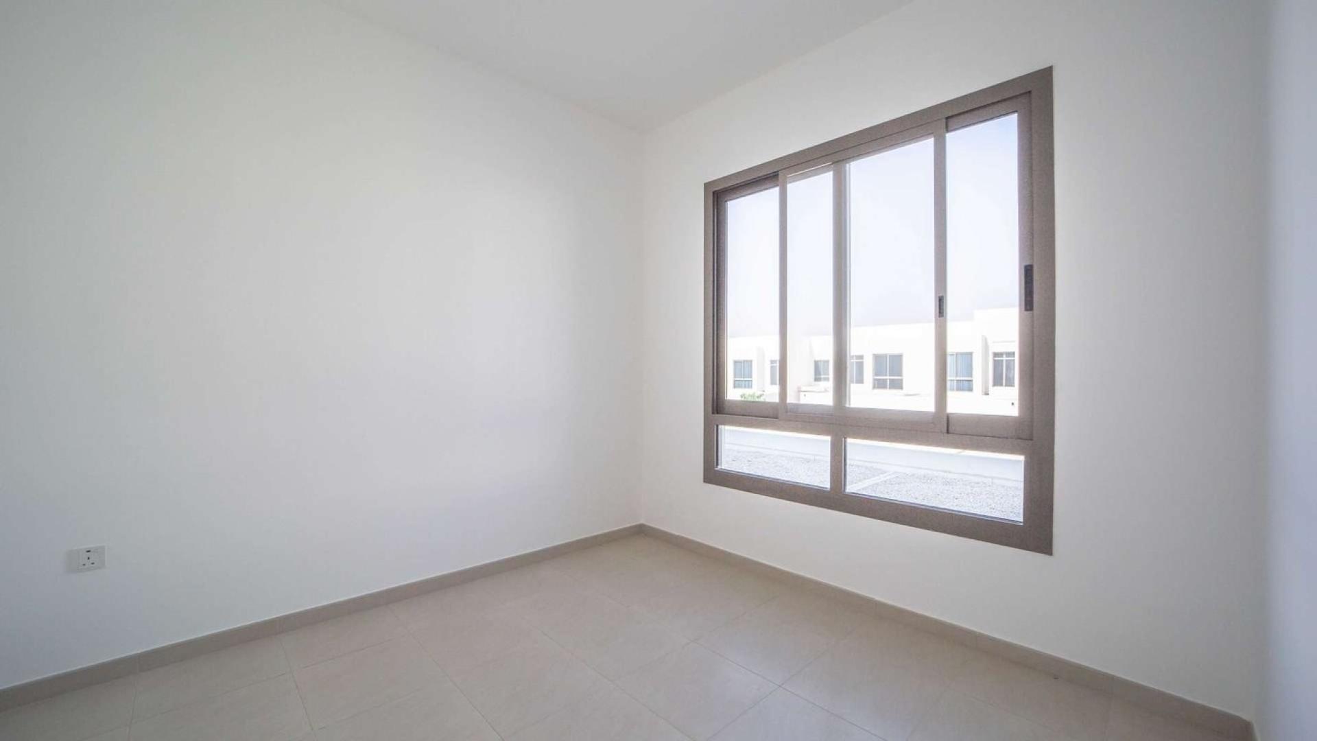 Luxury townhouses at Hayat Townhouses, Dubai Town Square, featuring modern architecture and spacious layout