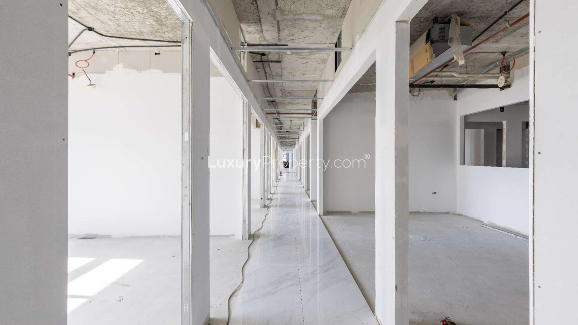 Lobby of Grosvenor Business Tower, Barsha Heights, showcasing modern design and directory board