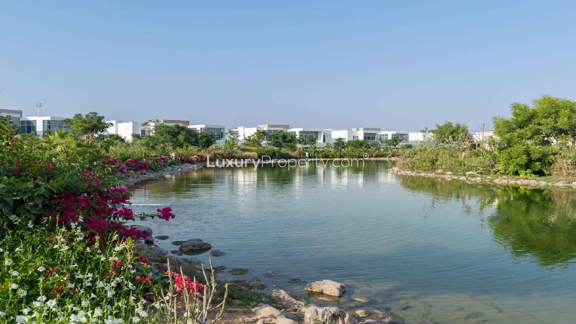 Scenic view of lush greenery and water feature in Al Barari residential land for sale