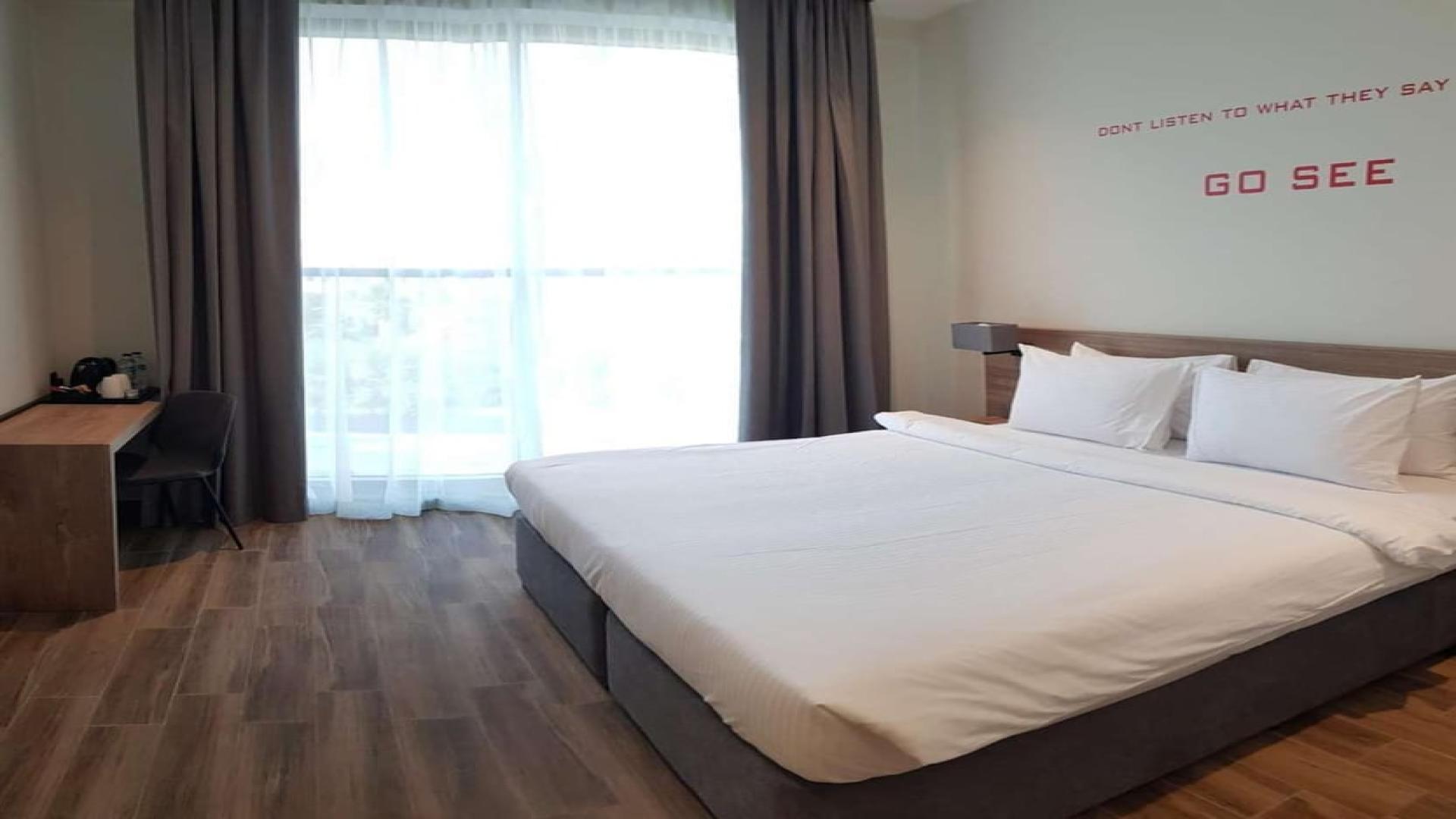 Studio bedroom in four-star waterfront hotel investment, featuring modern decor and cozy ambiance