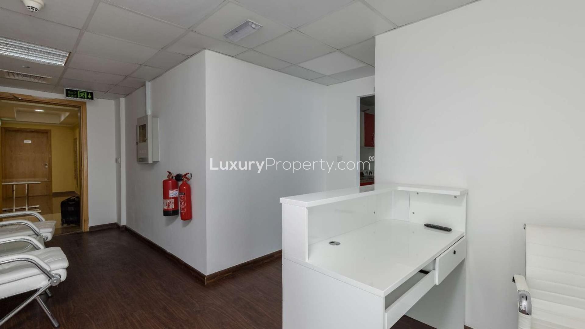 Tenanted office space in Business Bay's XL Tower with modern furnishings and large windows