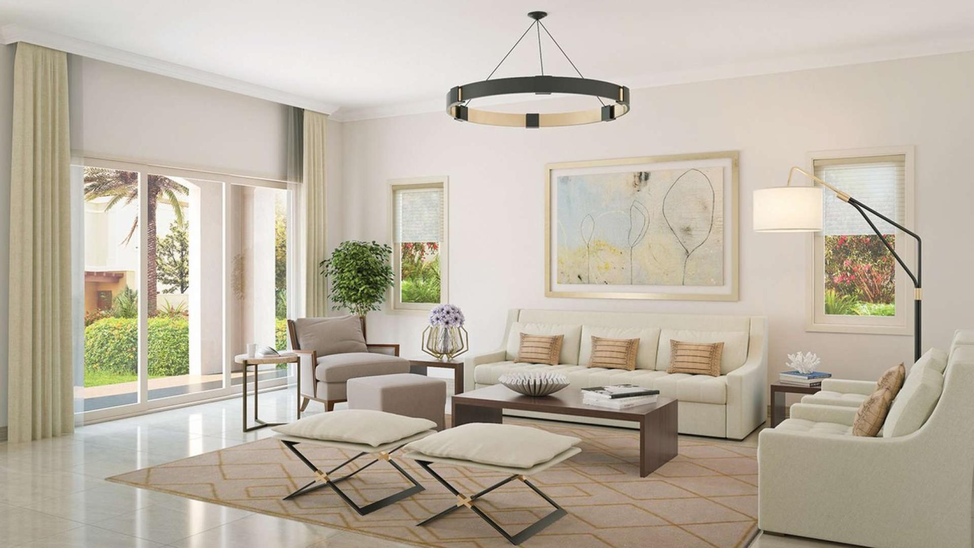 Spanish-style villa exterior in Villanova, Dubailand with lush landscaping and modern design