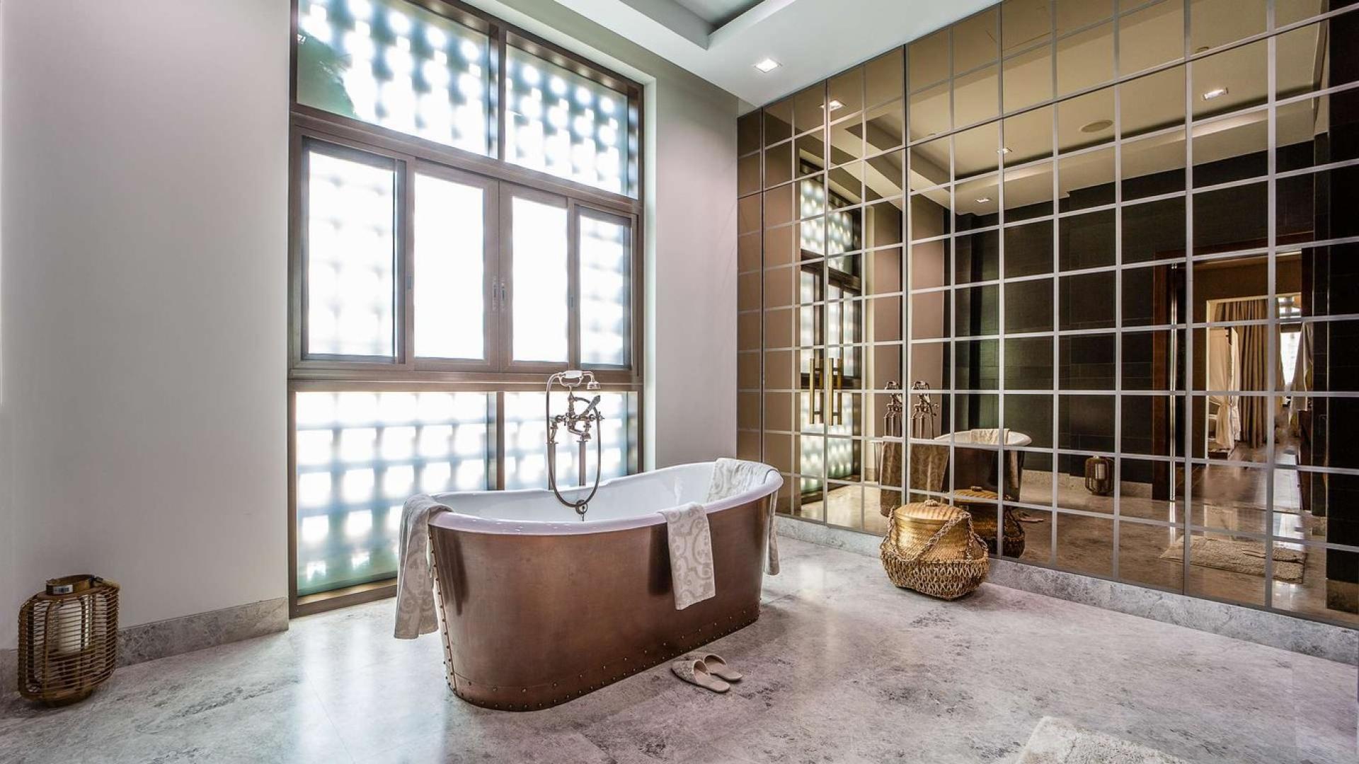 Elegant villa entrance with palm trees in District One, Mohammed Bin Rashid City