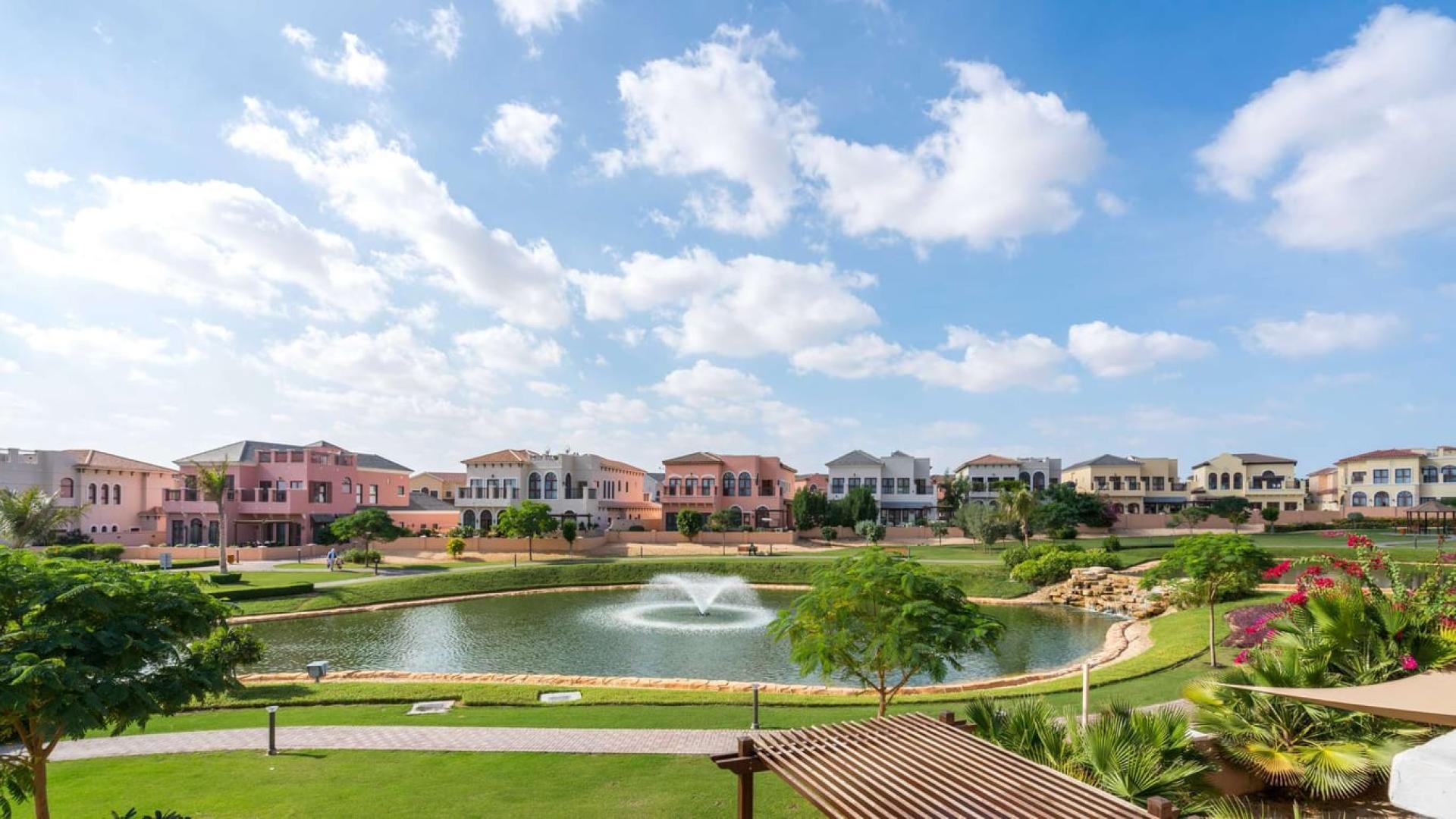 Luxury villas overlooking serene lake at Orange Lake, Jumeirah Golf Estates, Fire community