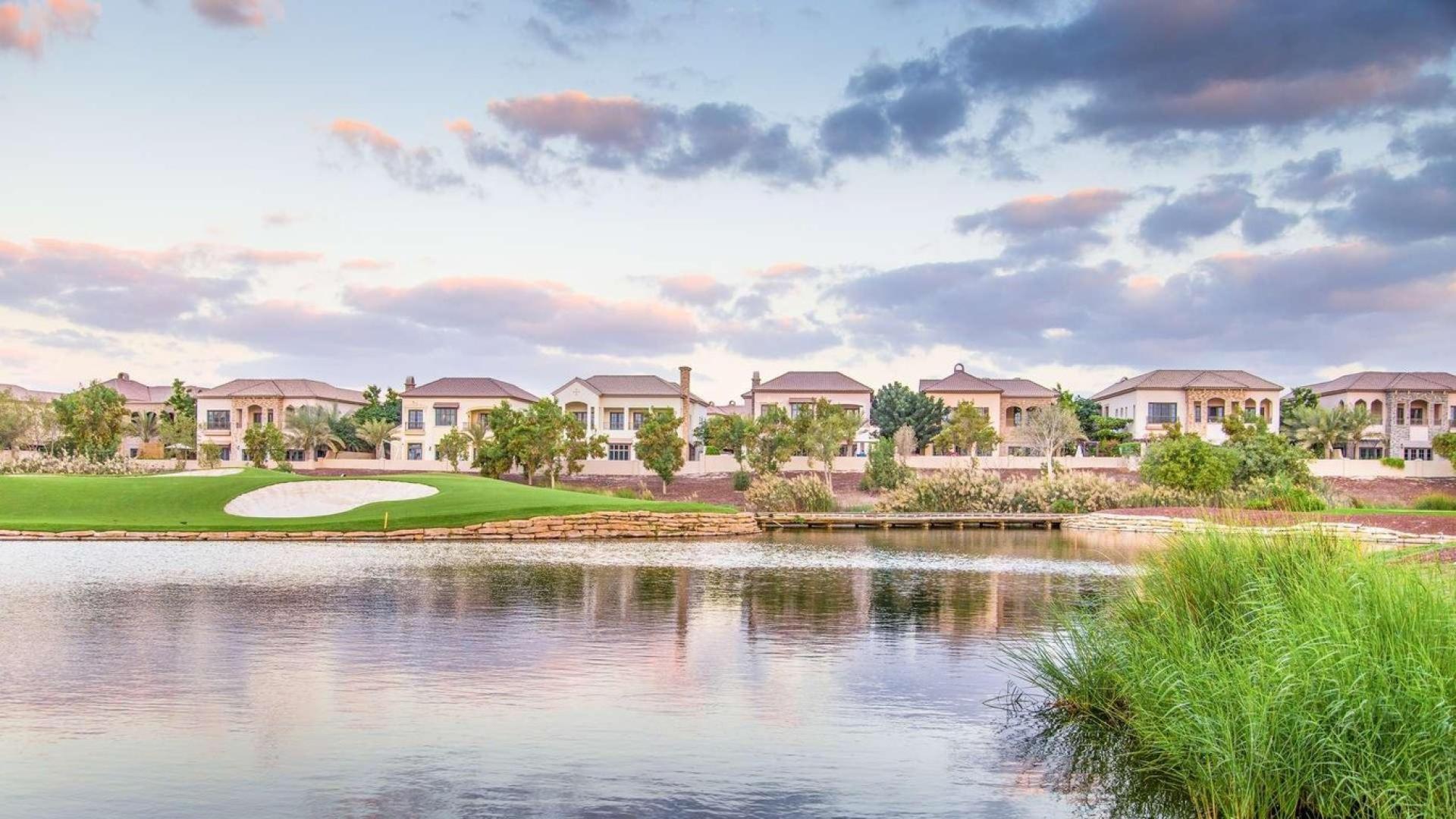 Orange Lake villa view, serene waterfront, lush greenery, Jumeirah Golf Estates, Fire community