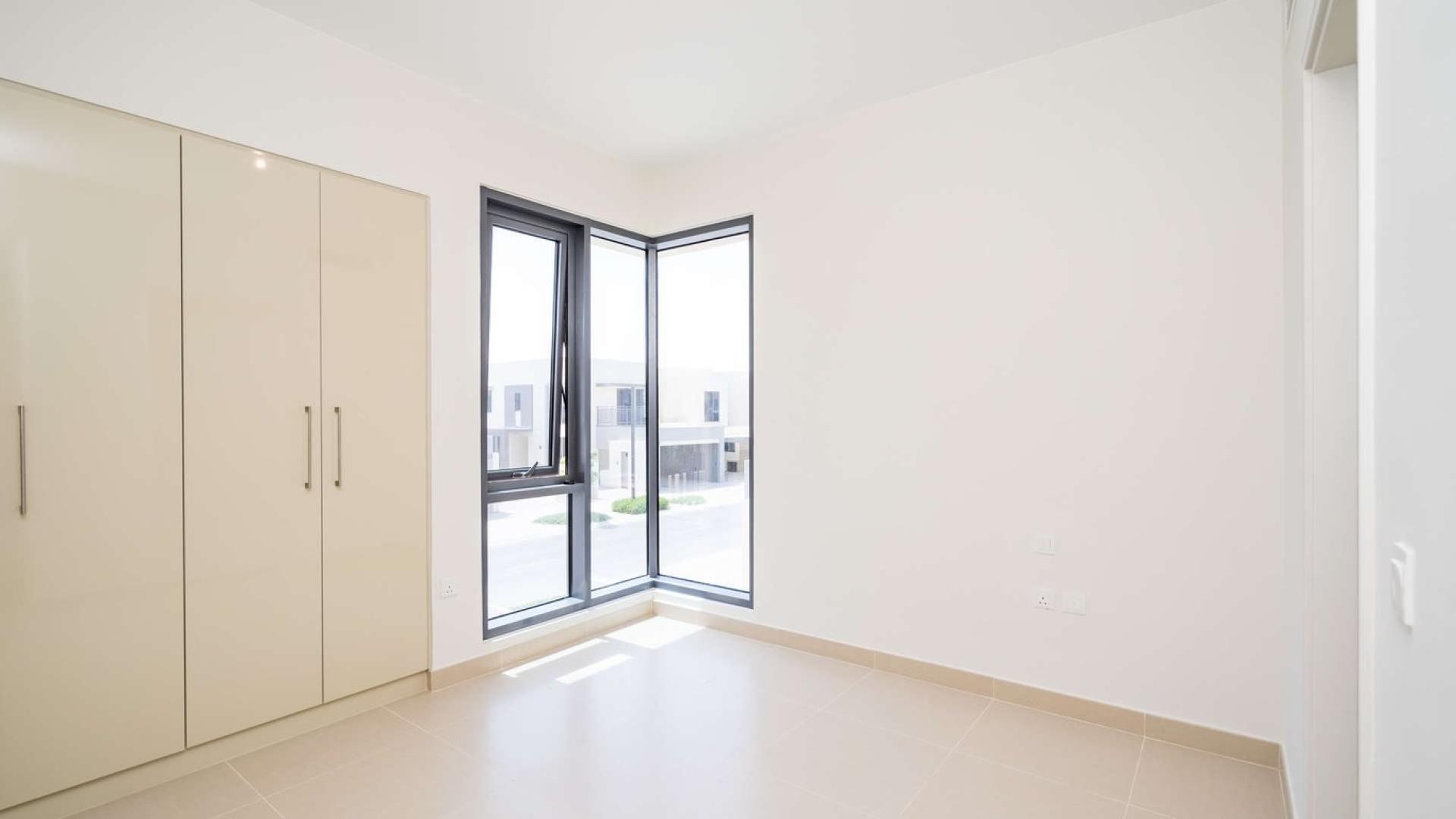 Modern kitchen with large windows in Dubai Hills Estate townhouse, Maple community