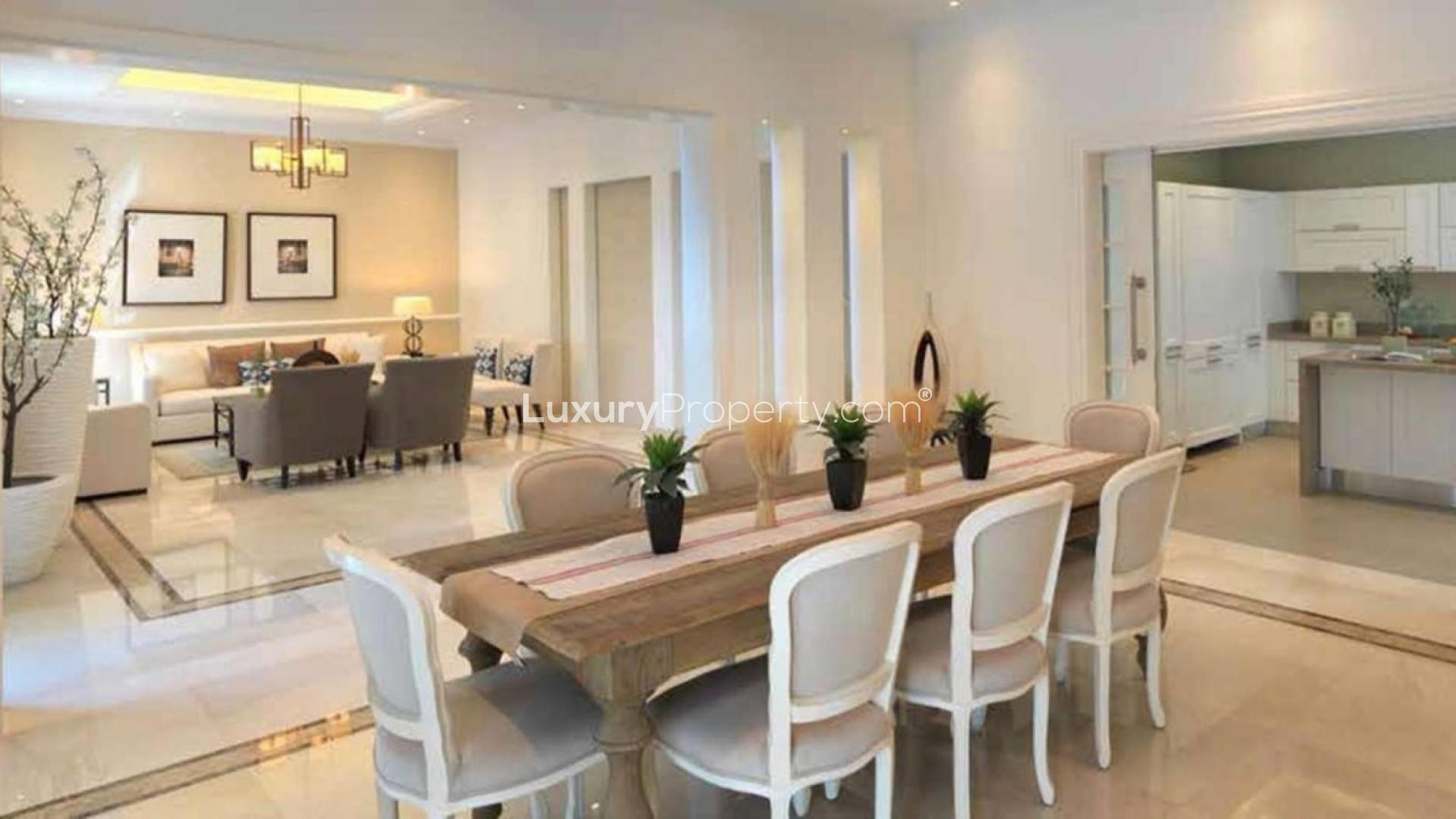 Aerial view of District One villas in Mohammed Bin Rashid City, Dubai skyline in background