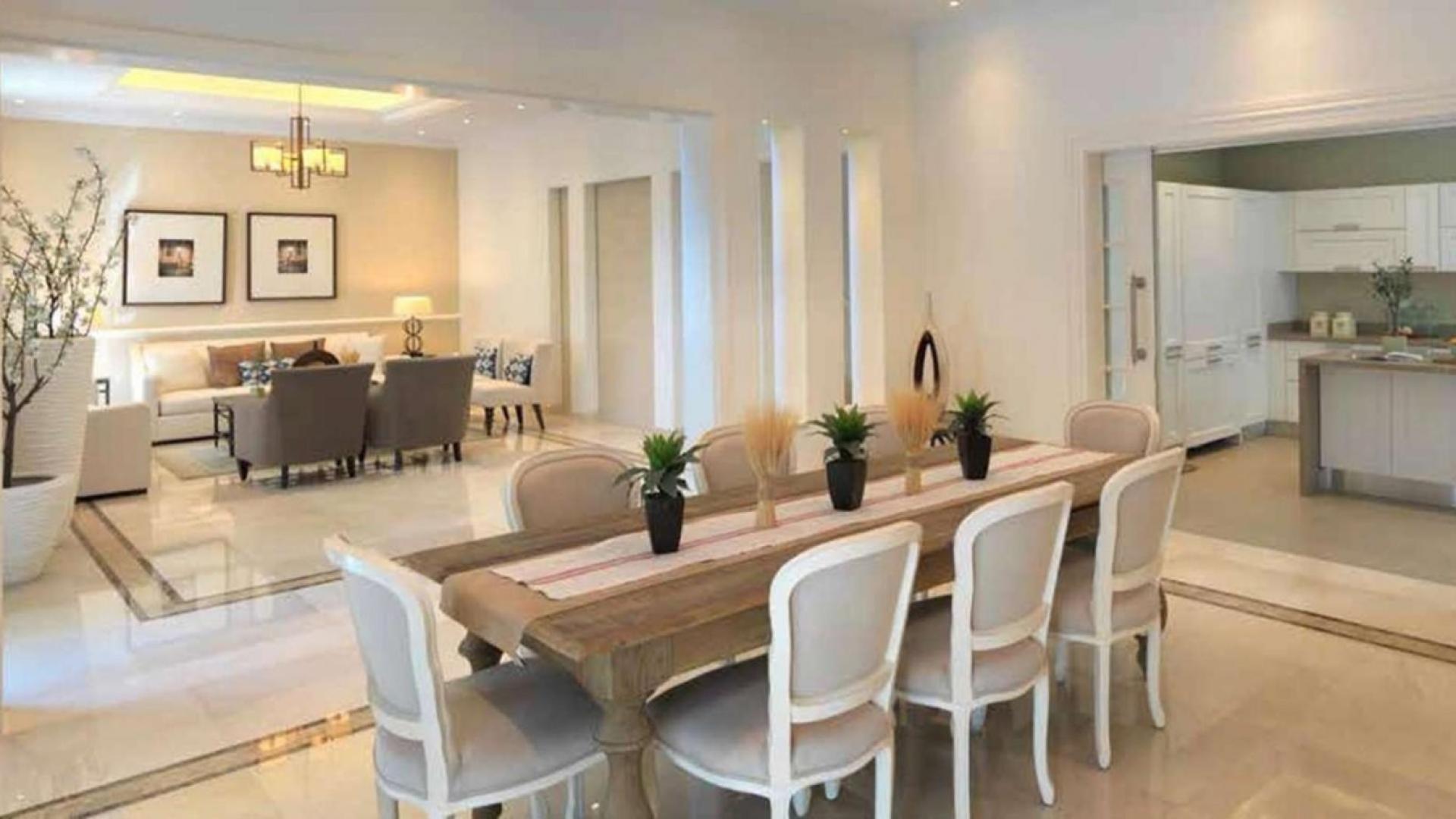 Aerial view of District One villas in Mohammed Bin Rashid City, Dubai skyline in background