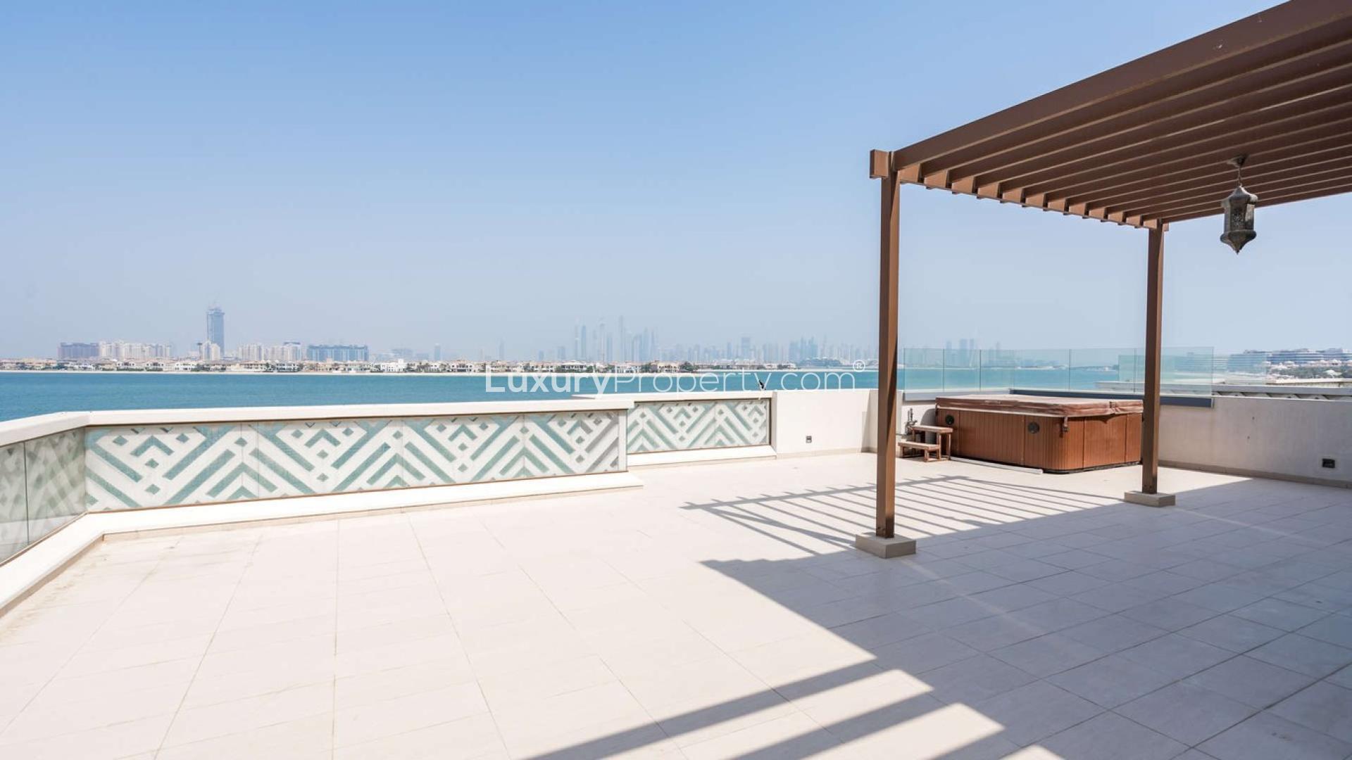Rooftop terrace view from Balqis Residences villa, Palm Jumeirah, with ocean and skyline