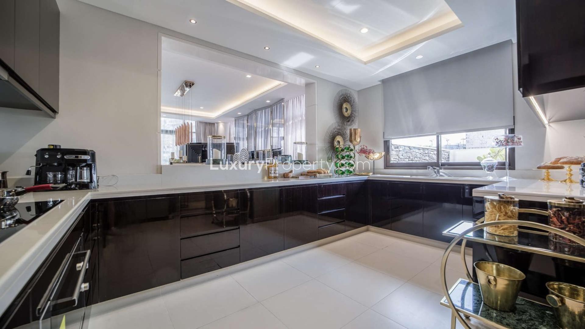 Luxurious living room in 5-bed villa at The Turf, Damac Hills with elegant decor