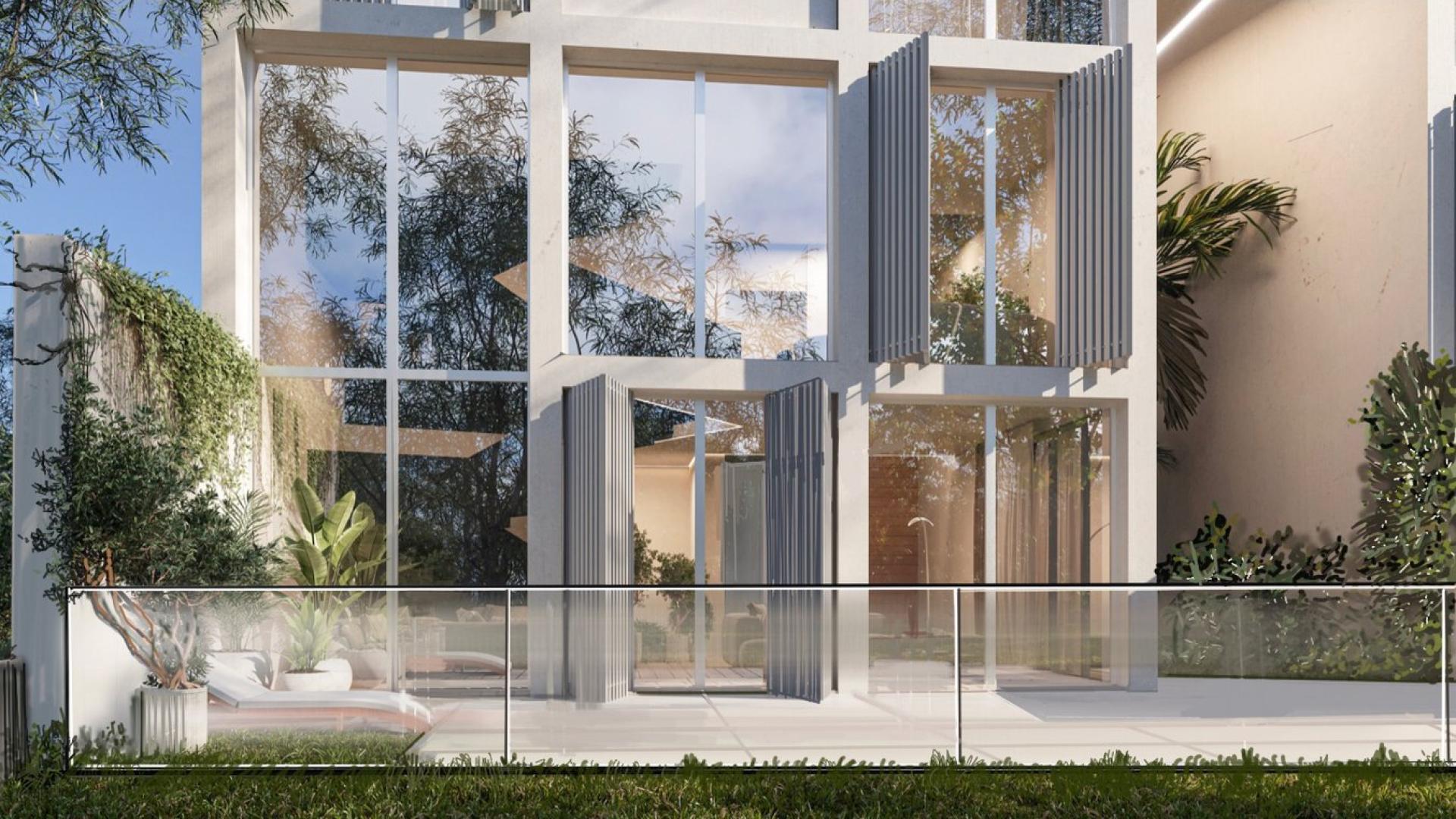 Luxurious outdoor seating area at Ixora Villas, Al Barari with lush greenery views