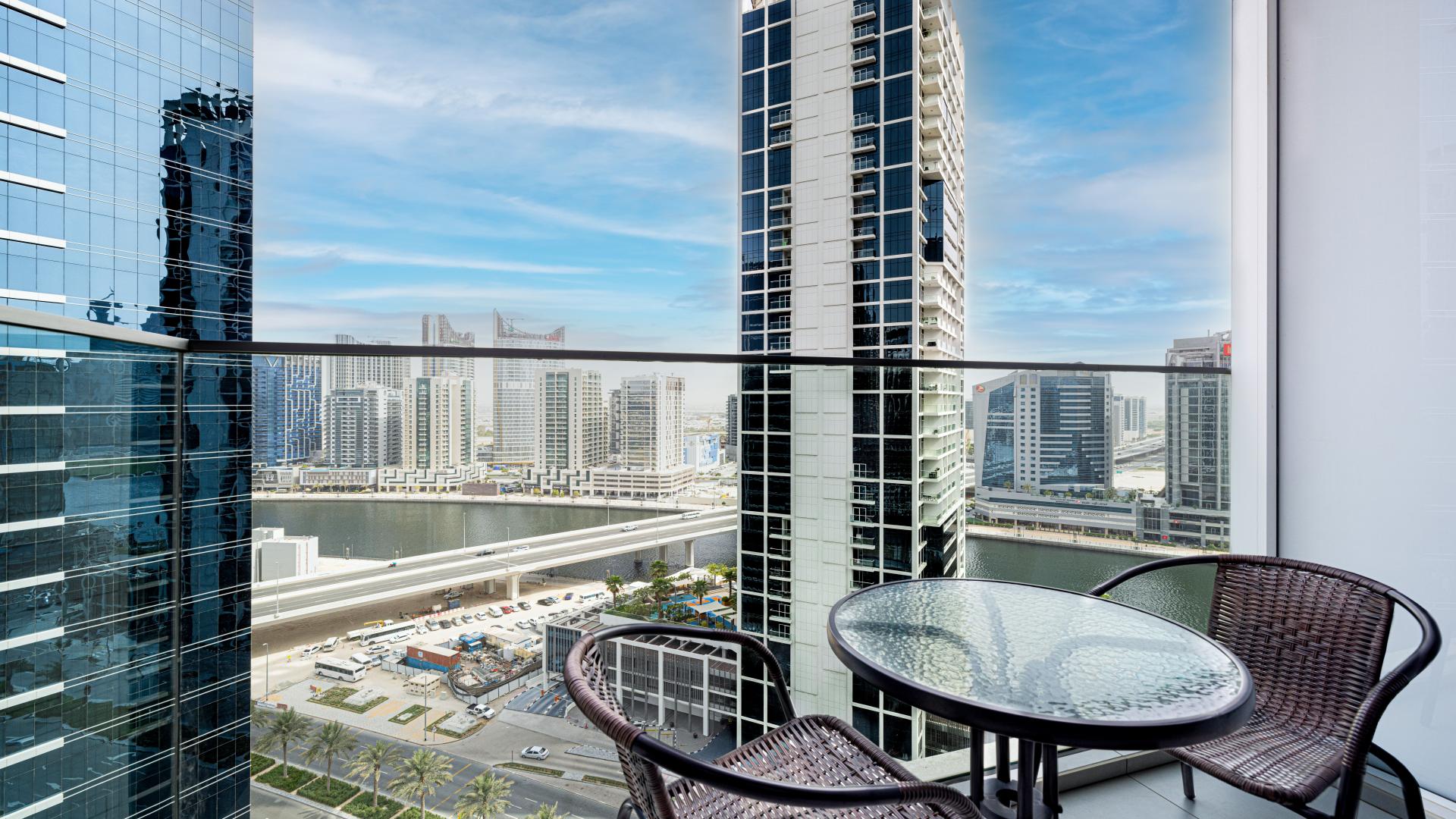 Modern studio apartment interior in Marquise Square Tower, Business Bay, featuring city views