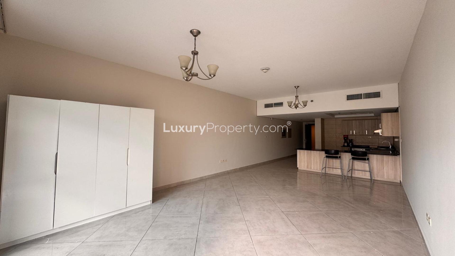 "Spacious studio apartment with modern kitchen in Jumeirah Village Circle, available for rent.",Spacious studio apartment with open kitchen at Chaimaa Premiere, Jumeirah Village Circle