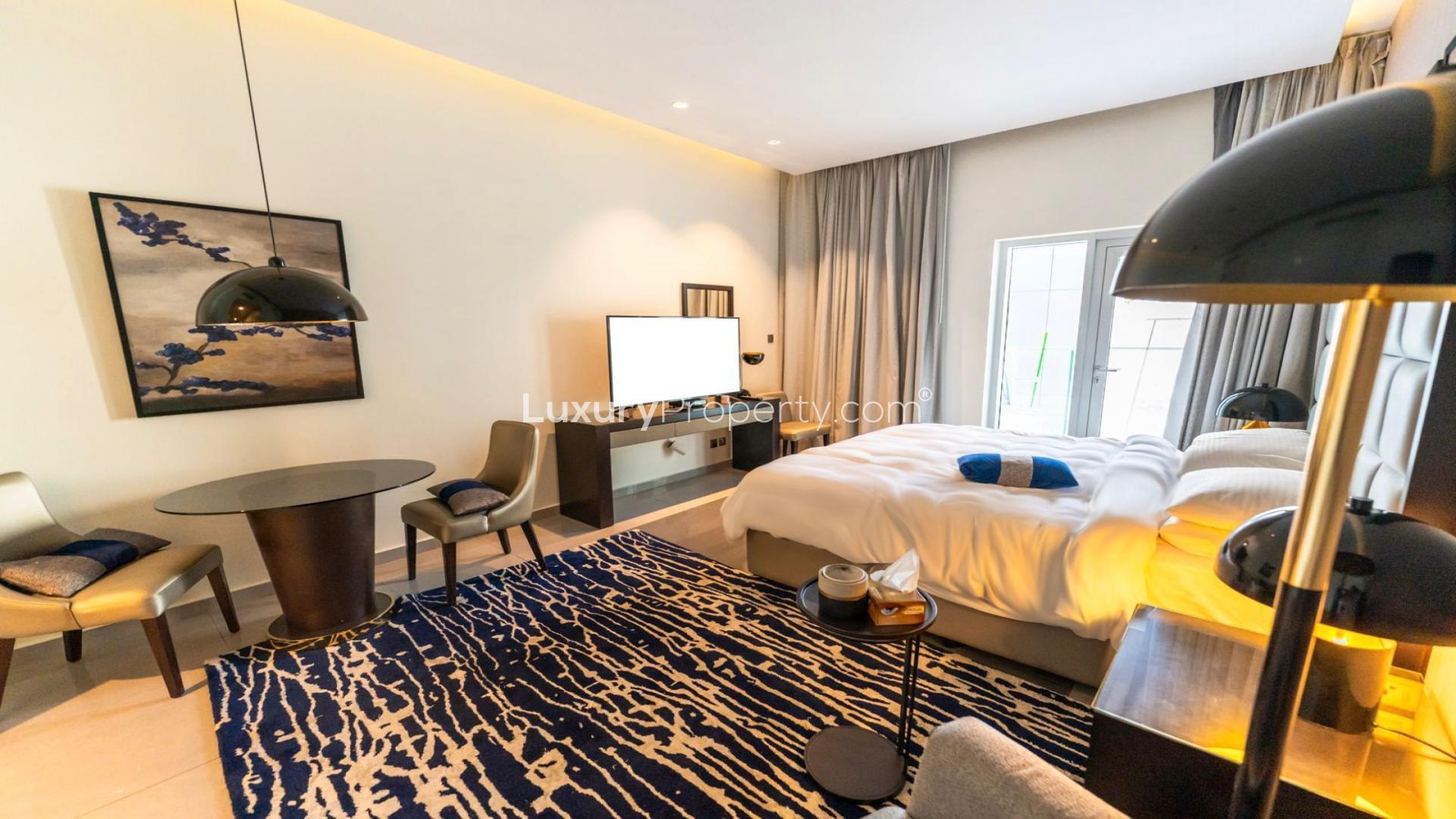 High-floor studio apartment in DAMAC Majestine, Business Bay, featuring modern decor and city view