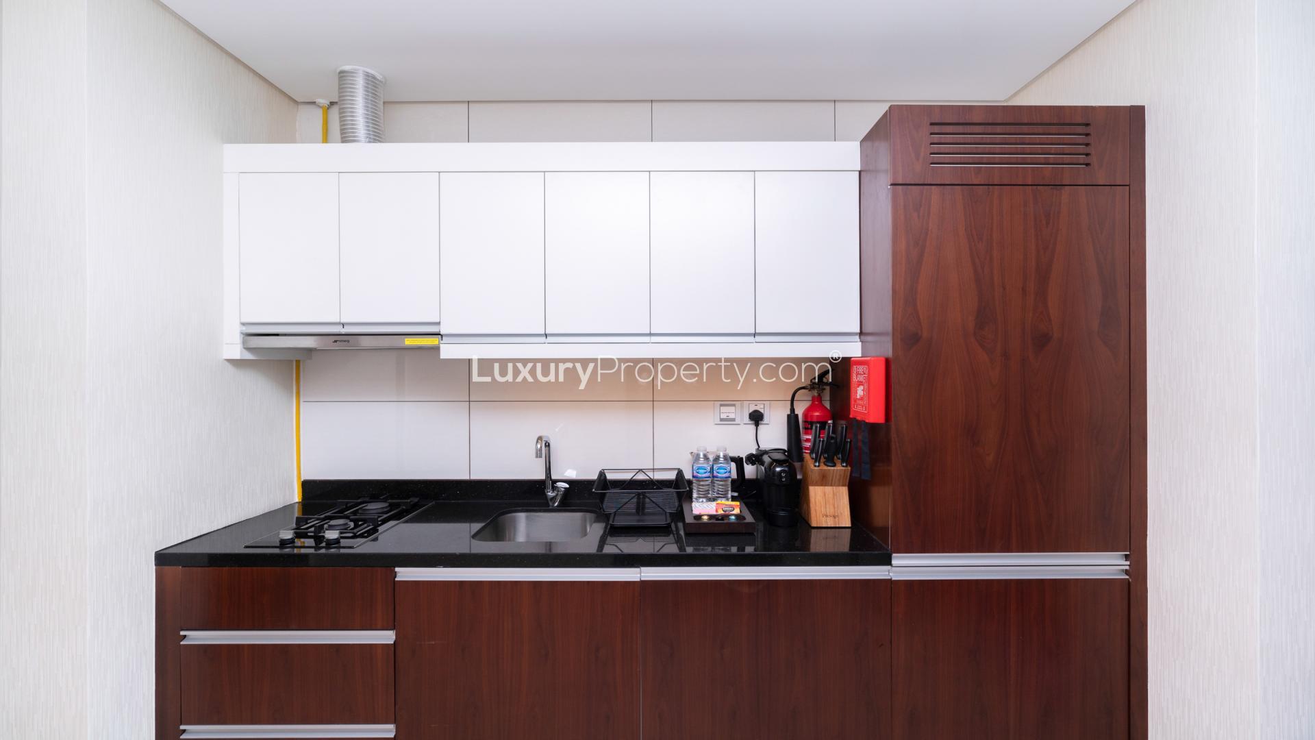 Elegantly furnished studio kitchen in Royal Continental Suites, Business Bay apartment for rent