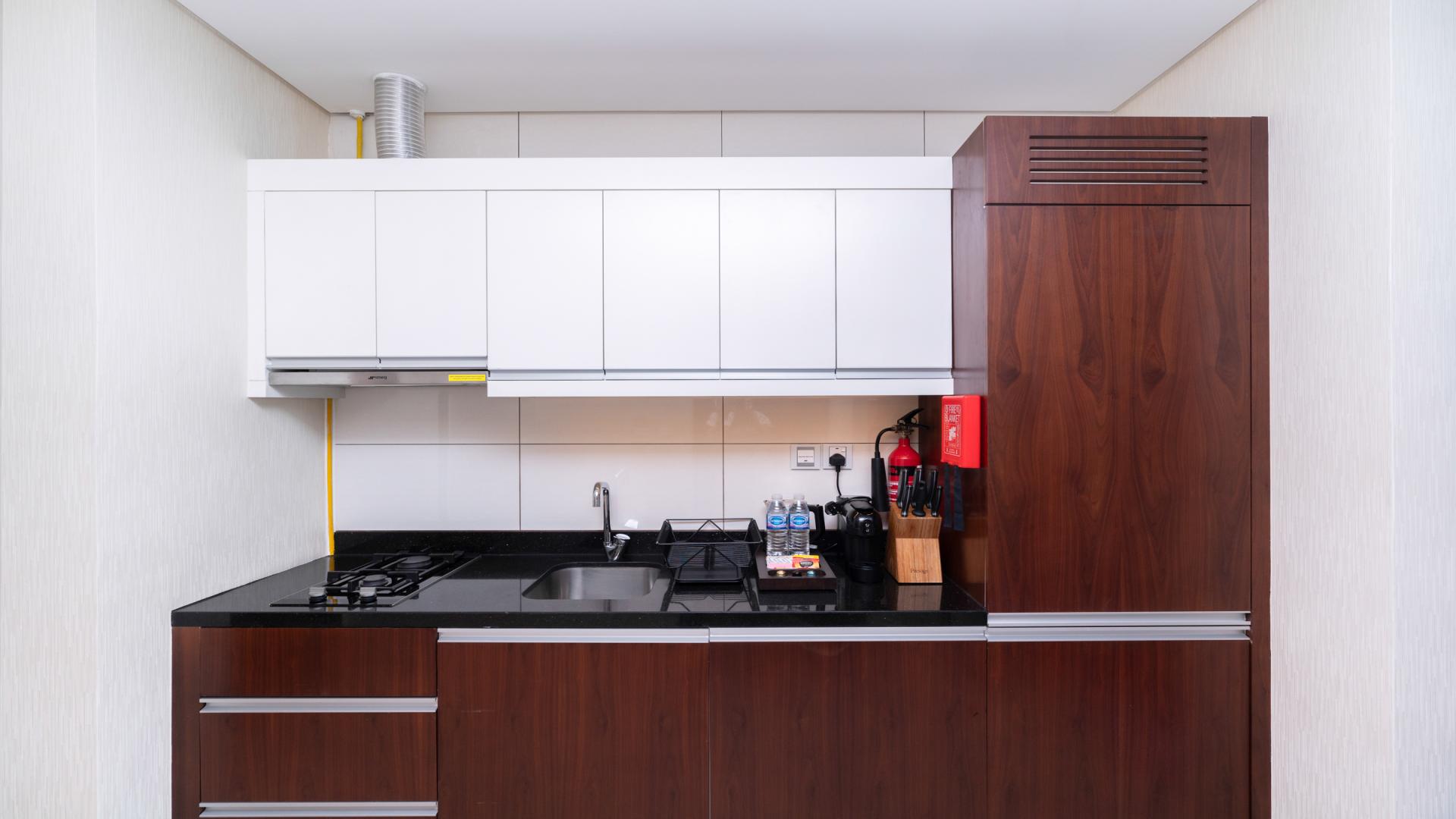 Elegantly furnished studio kitchen in Royal Continental Suites, Business Bay apartment for rent