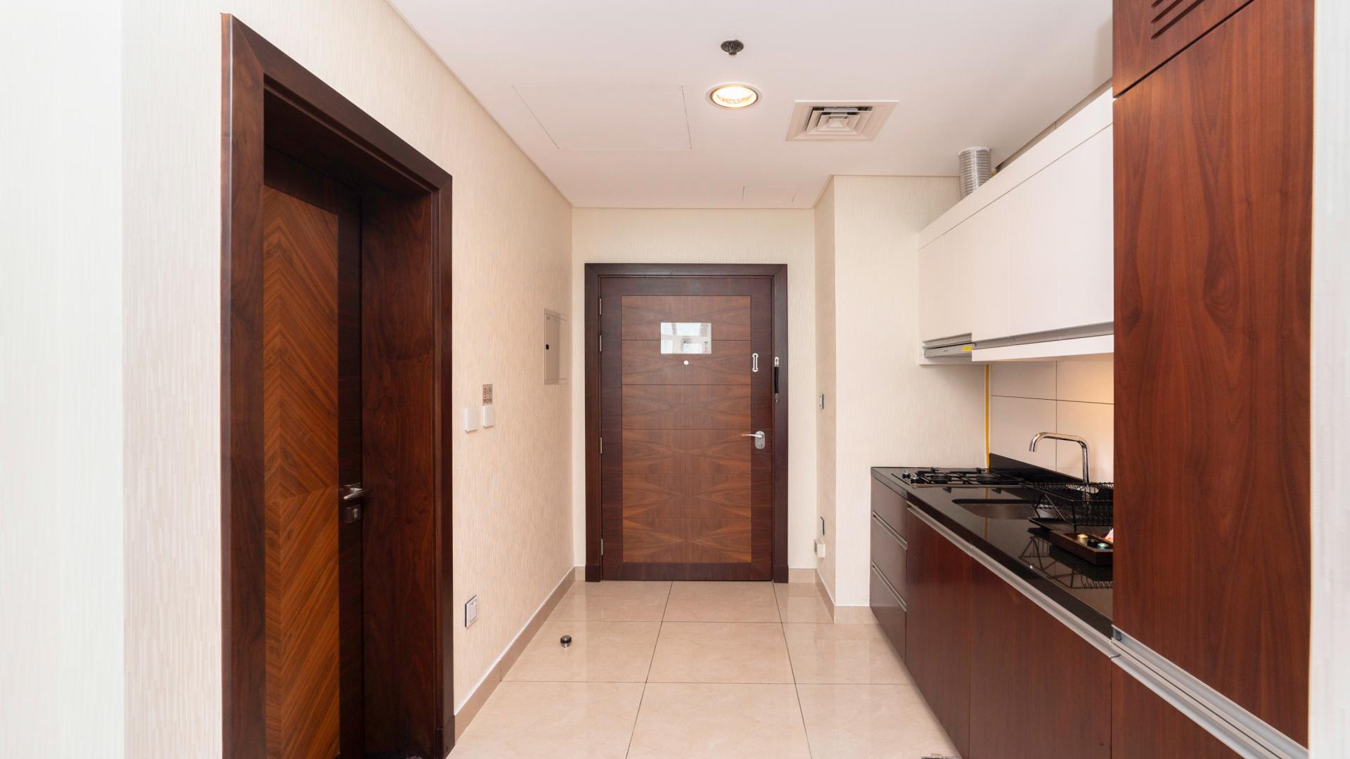 Elegantly furnished studio apartment kitchen and bedroom view, Royal Continental Suites, Business Bay