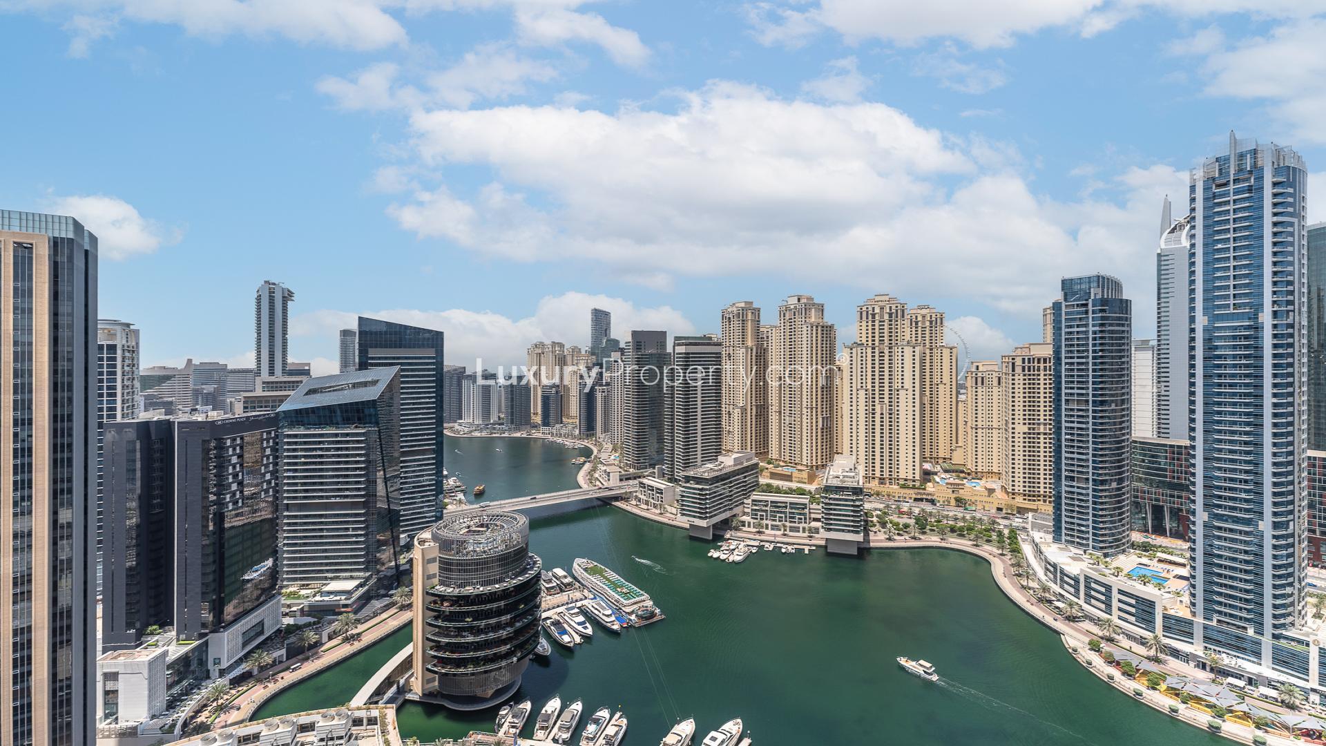 Studio apartment interior at JW Marriott, Dubai Marina, featuring cozy seating and elegant decor