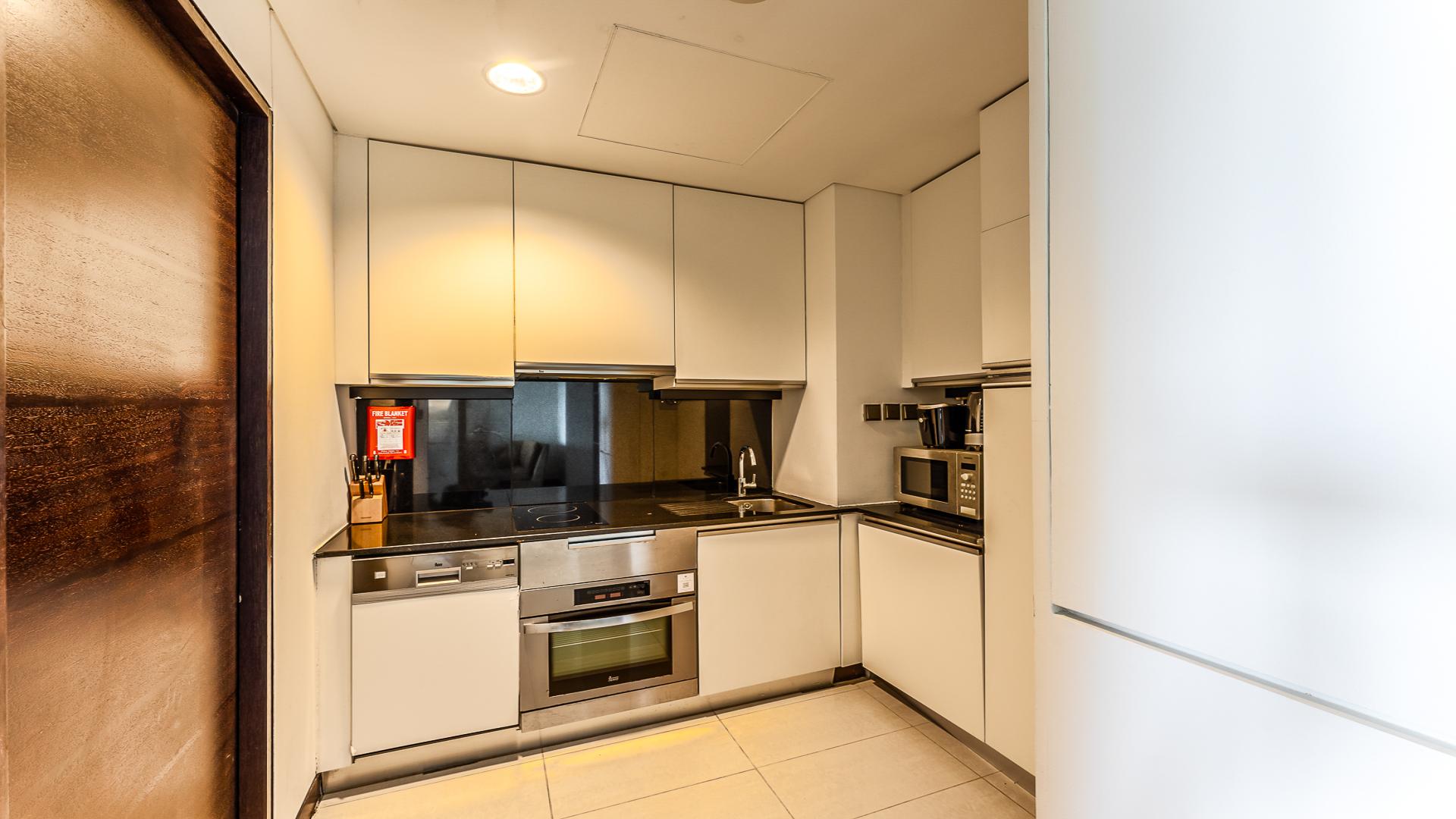 Dubai Marina skyline view from JW Marriott Hotel apartment, showcasing waterfront and skyscrapers