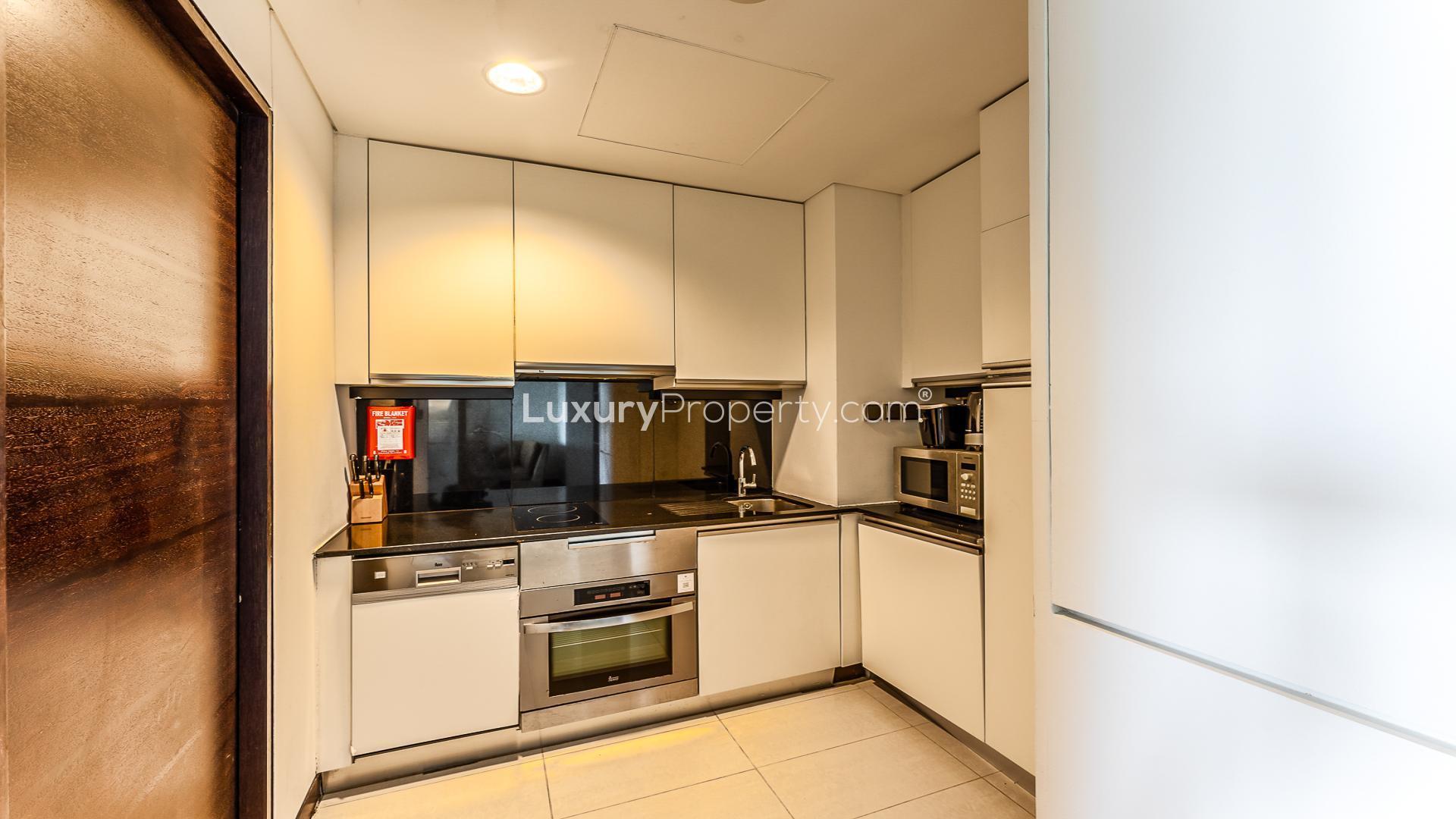 Luxurious Dubai Marina apartment bedroom with modern furnishings, JW Marriott Hotel sub-community