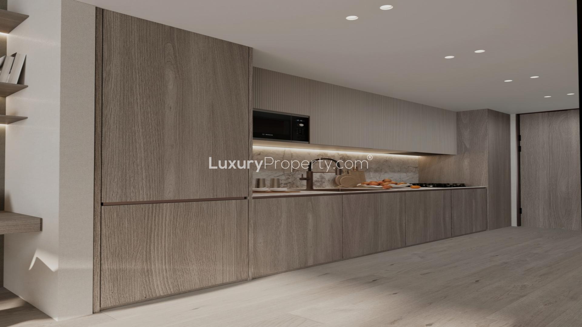 Modern living area in Cove Grand apartment, Dubai Land Residence Complex, with stylish interior design