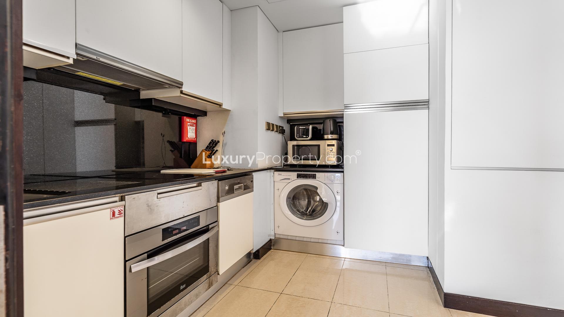 "Stunning view of Dubai Marina from JW Marriott Hotel Marina apartment balcony, LP47961 sale.",Compact kitchen with modern appliances in Dubai Marina apartment for sale, JW Marriott Hotel area