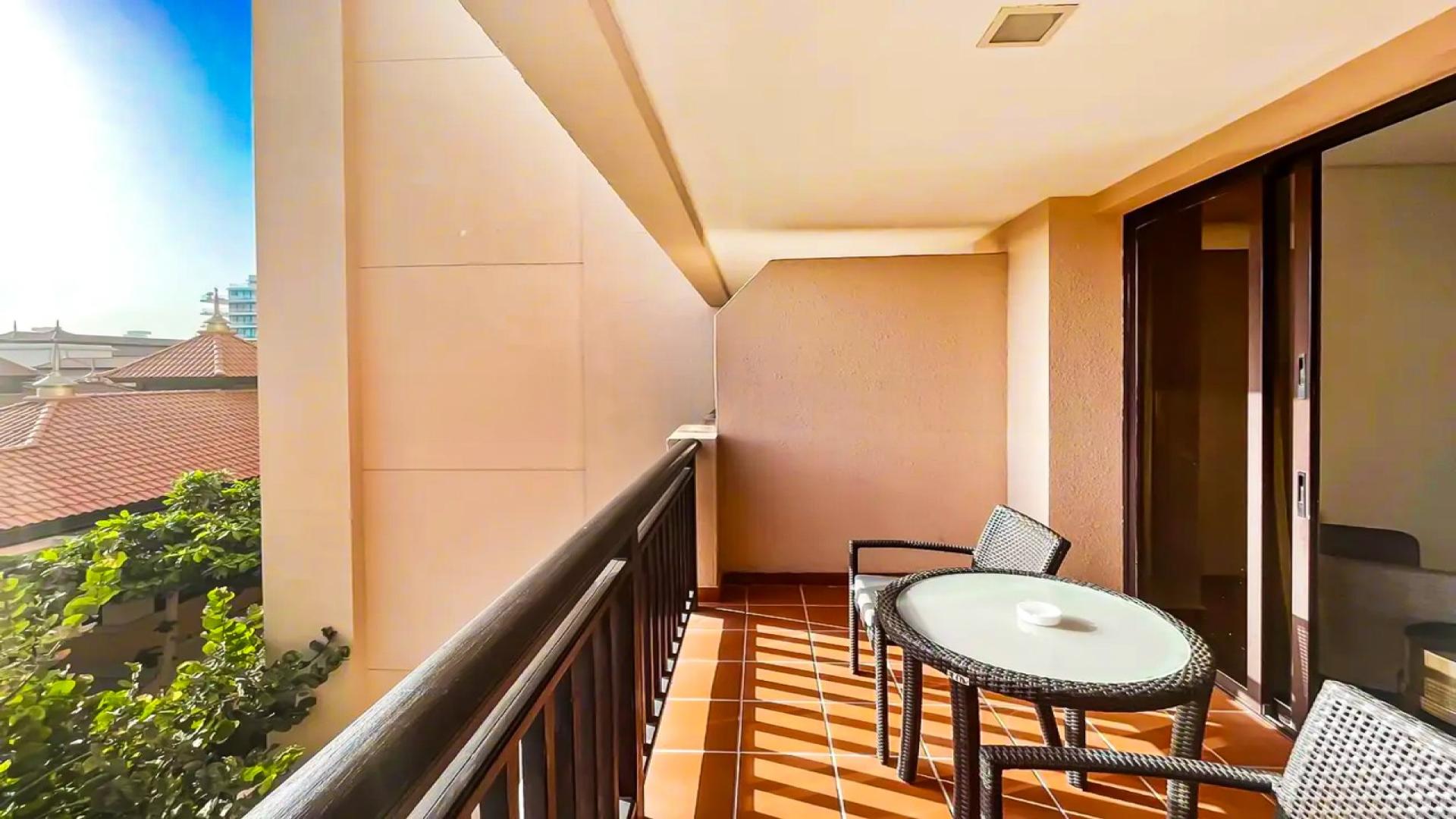 Balcony view of studio apartment in Royal Amwaj Residences, Palm Jumeirah, with outdoor seating