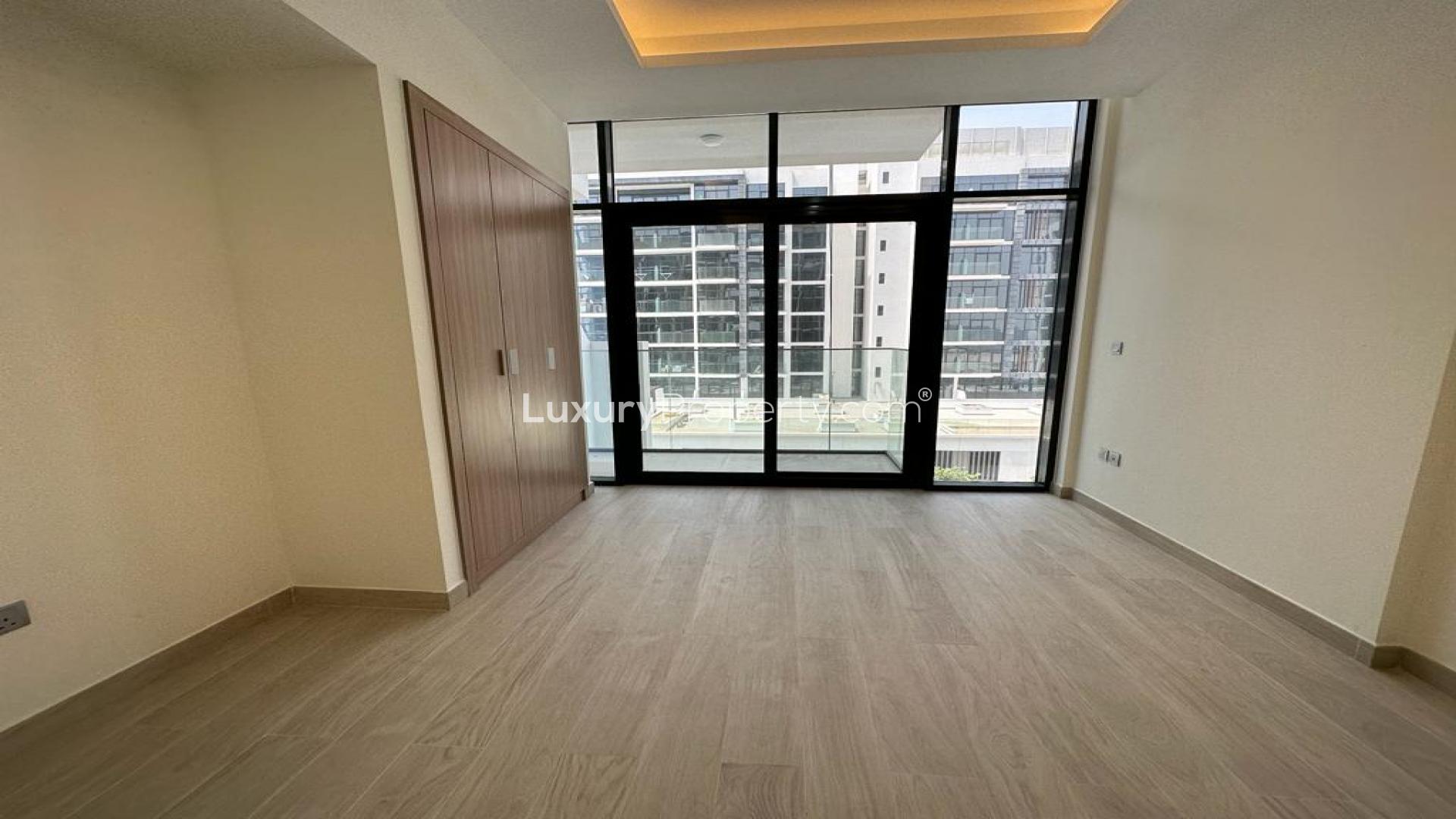 Spacious studio apartment interior in Azizi Victoria, MBR City, featuring open layout design