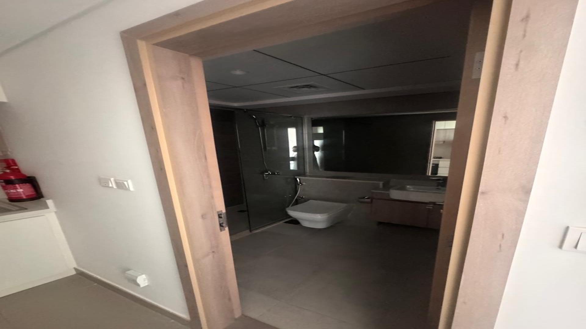 Laundry area with washing machine in Prive Residence apartment, Dubai Hills Estate