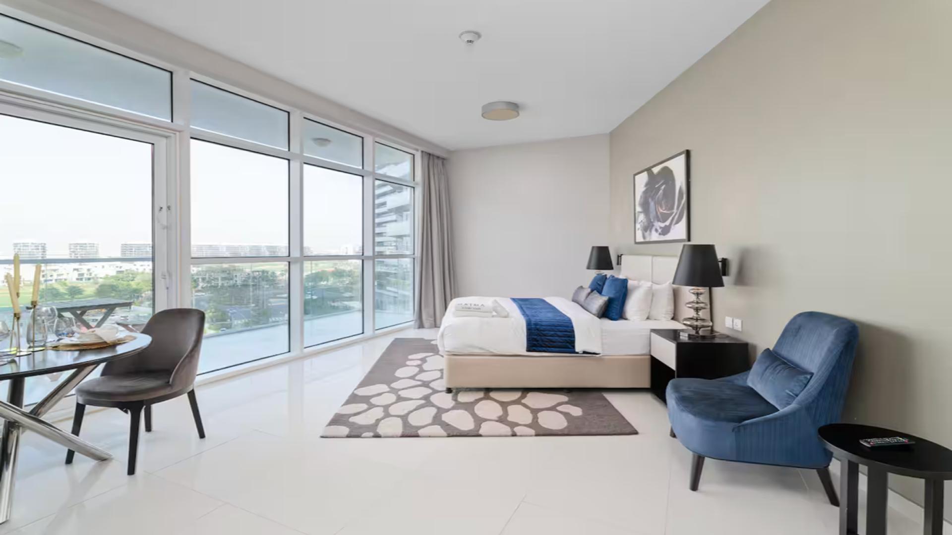 Modern studio apartment in Artesia, Damac Hills with large windows and stylish furnishings