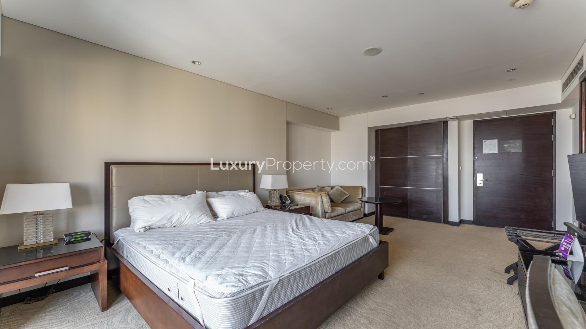 Balcony view from studio apartment at The Address Dubai Marina overlooking skyline and waterway