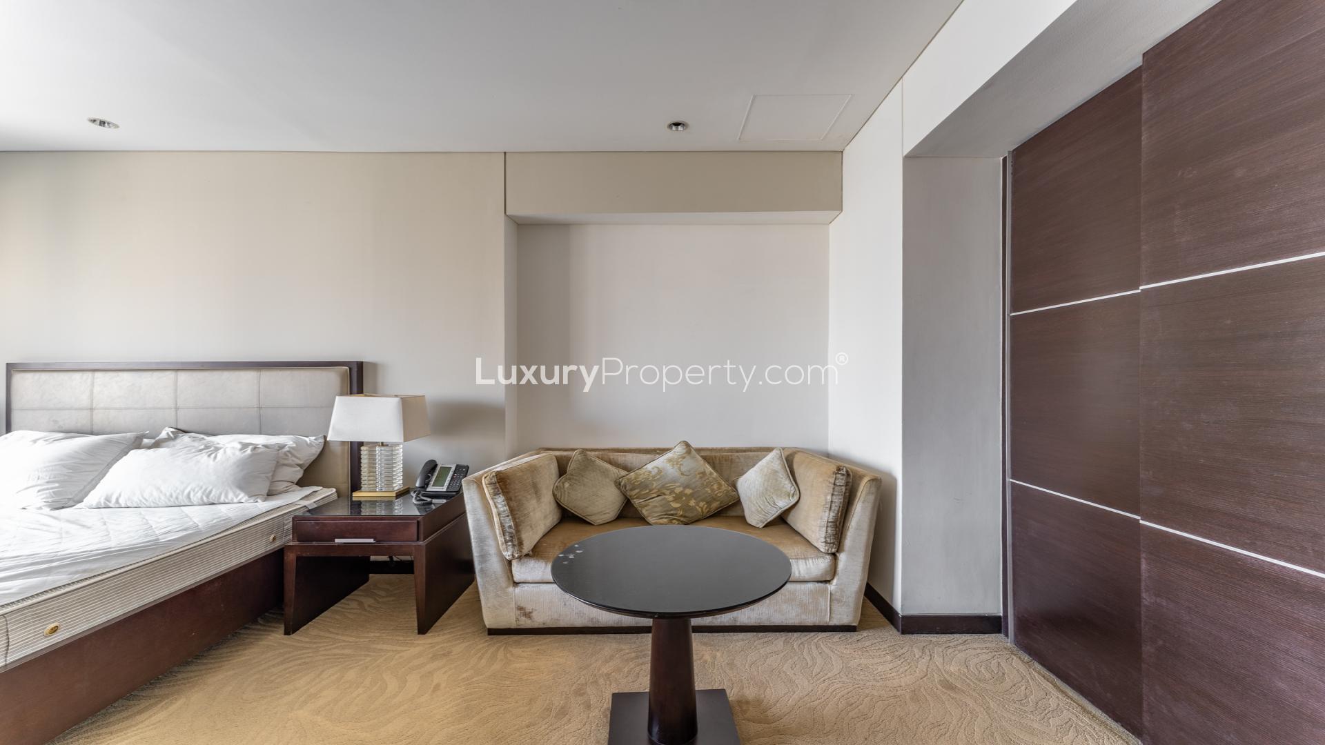 Studio apartment interior in The Address Dubai Marina, featuring modern furnishings and neutral decor